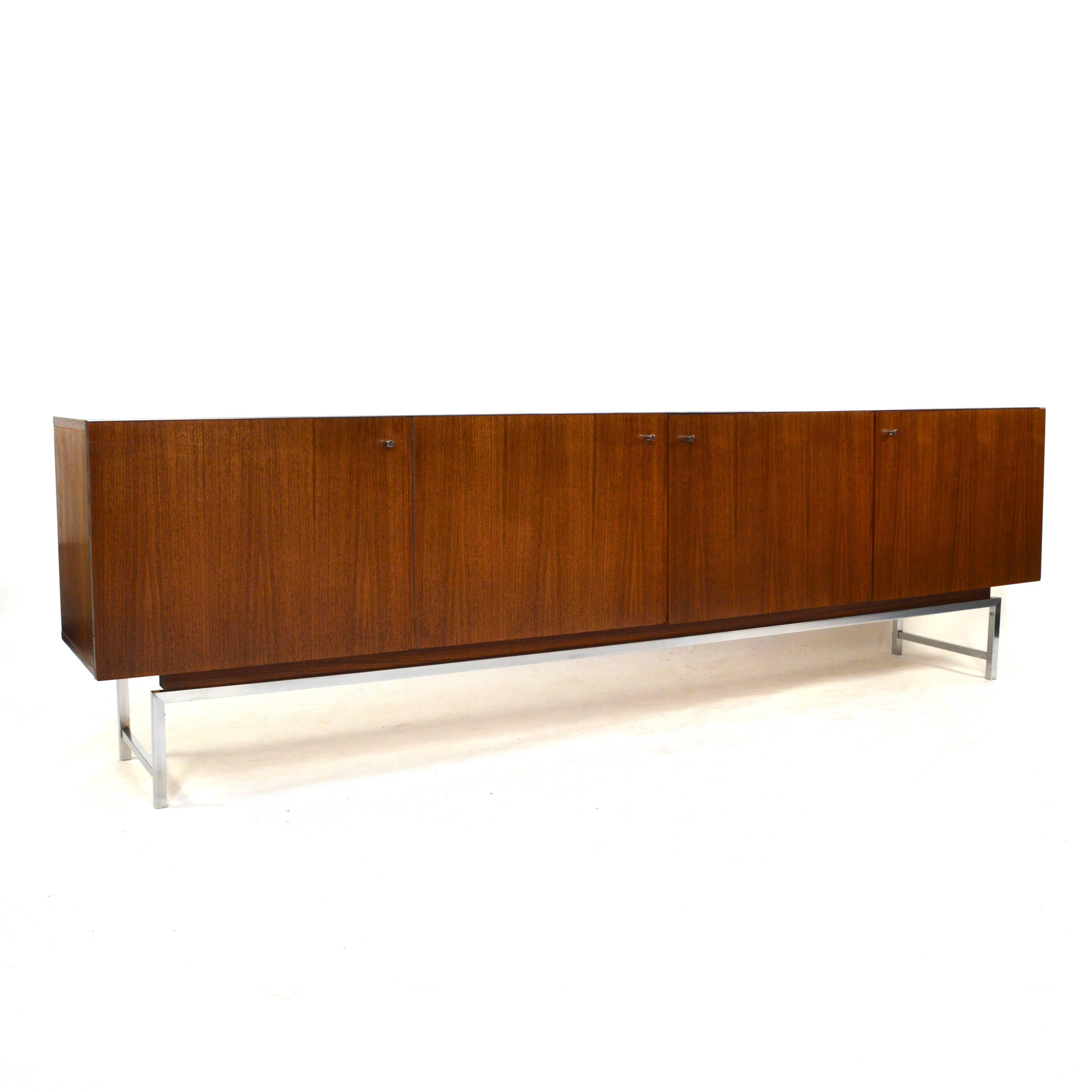 Gorgeous minimalistic and timeless sideboard in rosewood by Rudolf B. Glatzel for Fristho, 1960s.
It features four doors and inside three drawers and two in height adjustable shelves.

Designer: Rudolf B. Glatzel
Manufacturer: Fristho
Country: