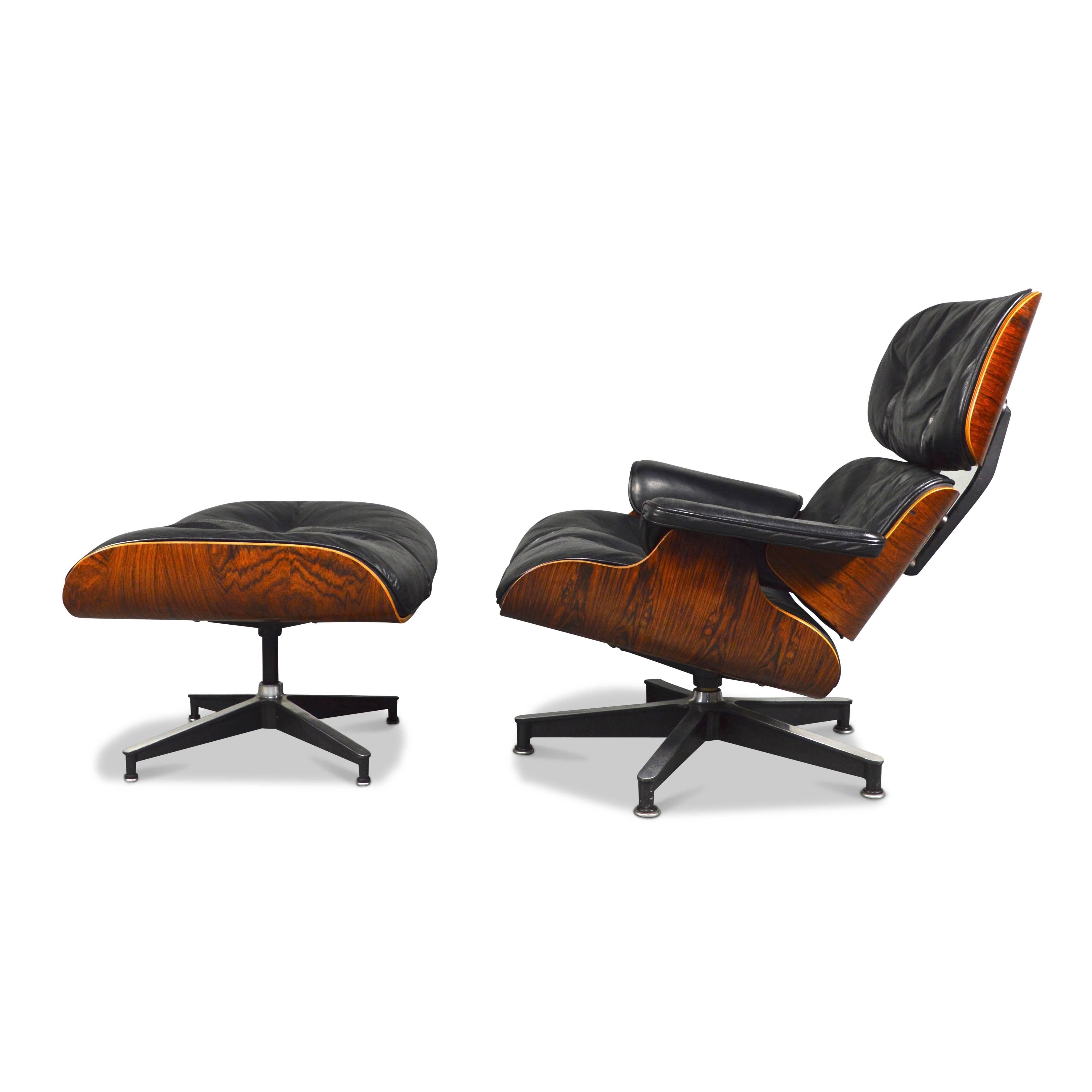 Second generation Charles and Ray Eames lounge chair with ottoman by Herman Miller.
Early 1960s production.
It has the round white metal brand plate on the bottom.
The chair is down filled.
The rosewood has a beautiful wood grain, a very warm color