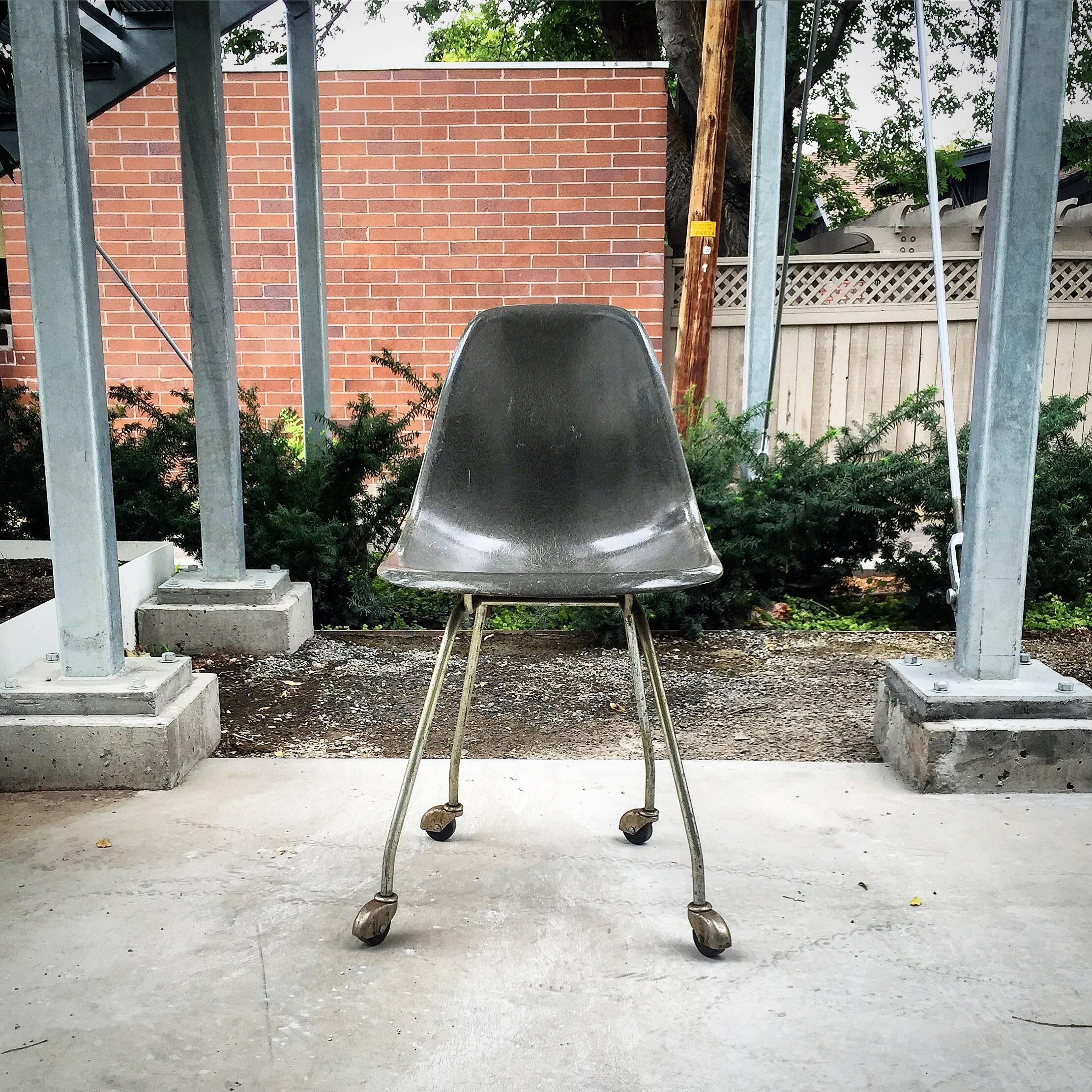 Elephant hyde grey side shell chair on original prototype H-base with casters
this came out of California.
It is in great vintage condition with minor rusting on the base.
                  