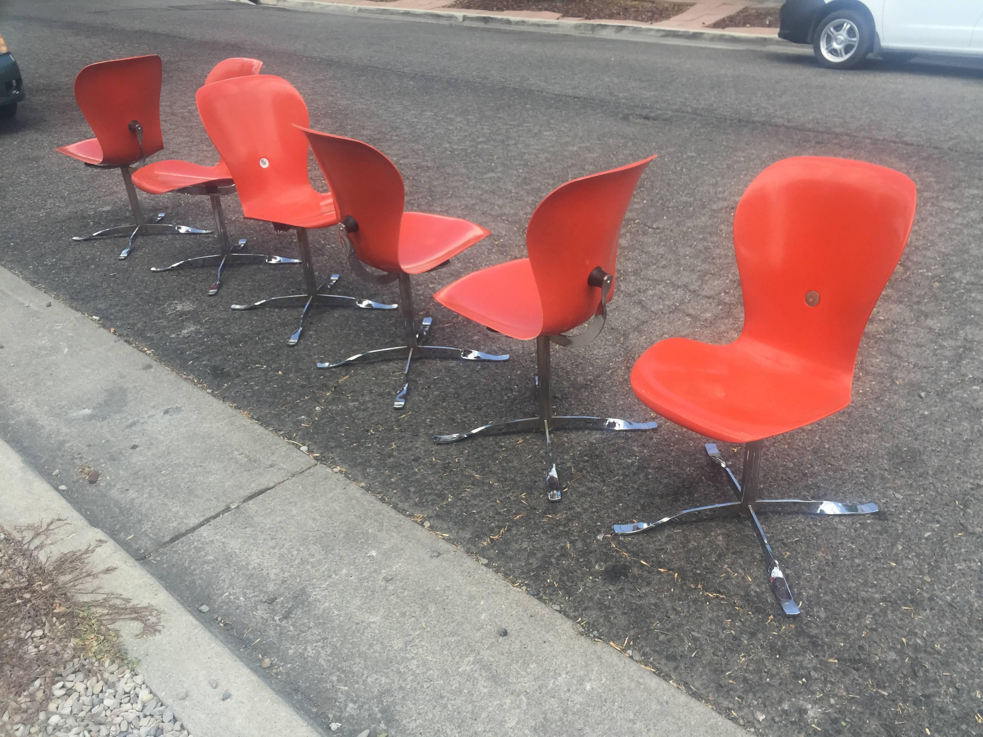 Set of six bright orange/red ion chairs designed by Gideon Kramer for the 1962 worlds fair and displayed in the space needle.
     