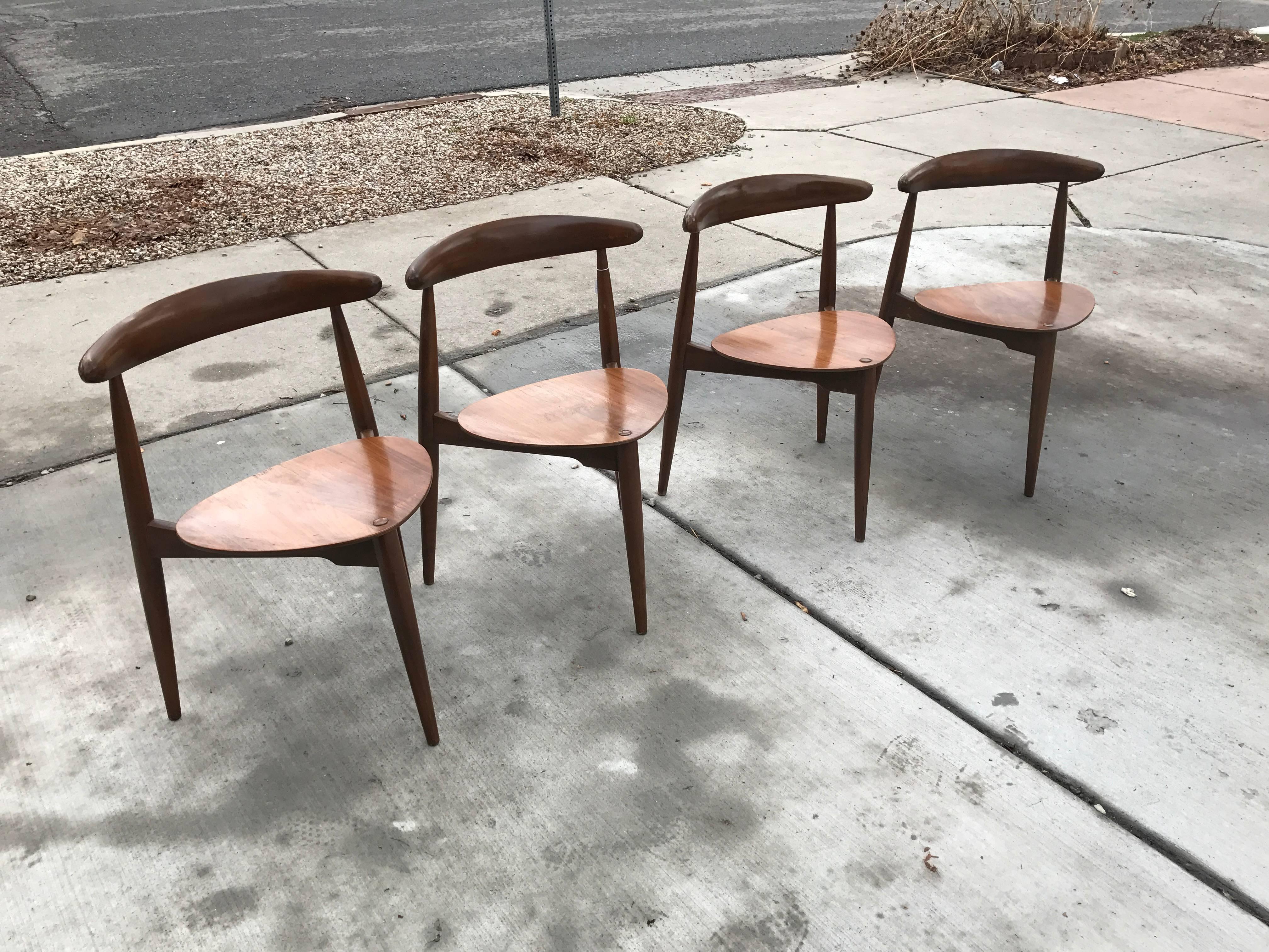 Beautiful sculpted unique and striking three legged chairs designed by Hans J Wegner
all in great vintage condition
these do stack
and all are sturdy.
  