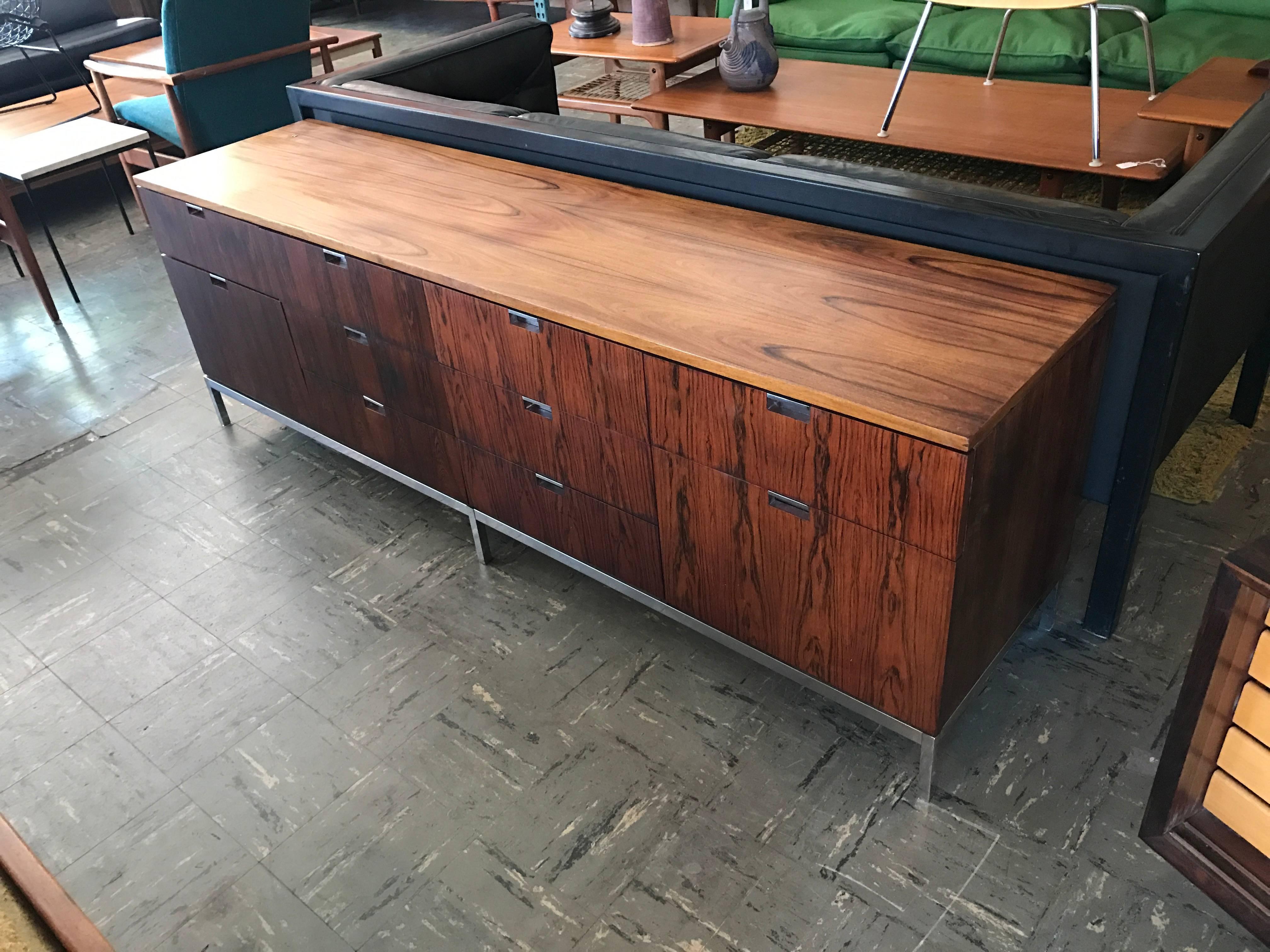 Beautiful rosewood credenza
designed by Florence Knoll
in good condition some wear from age.