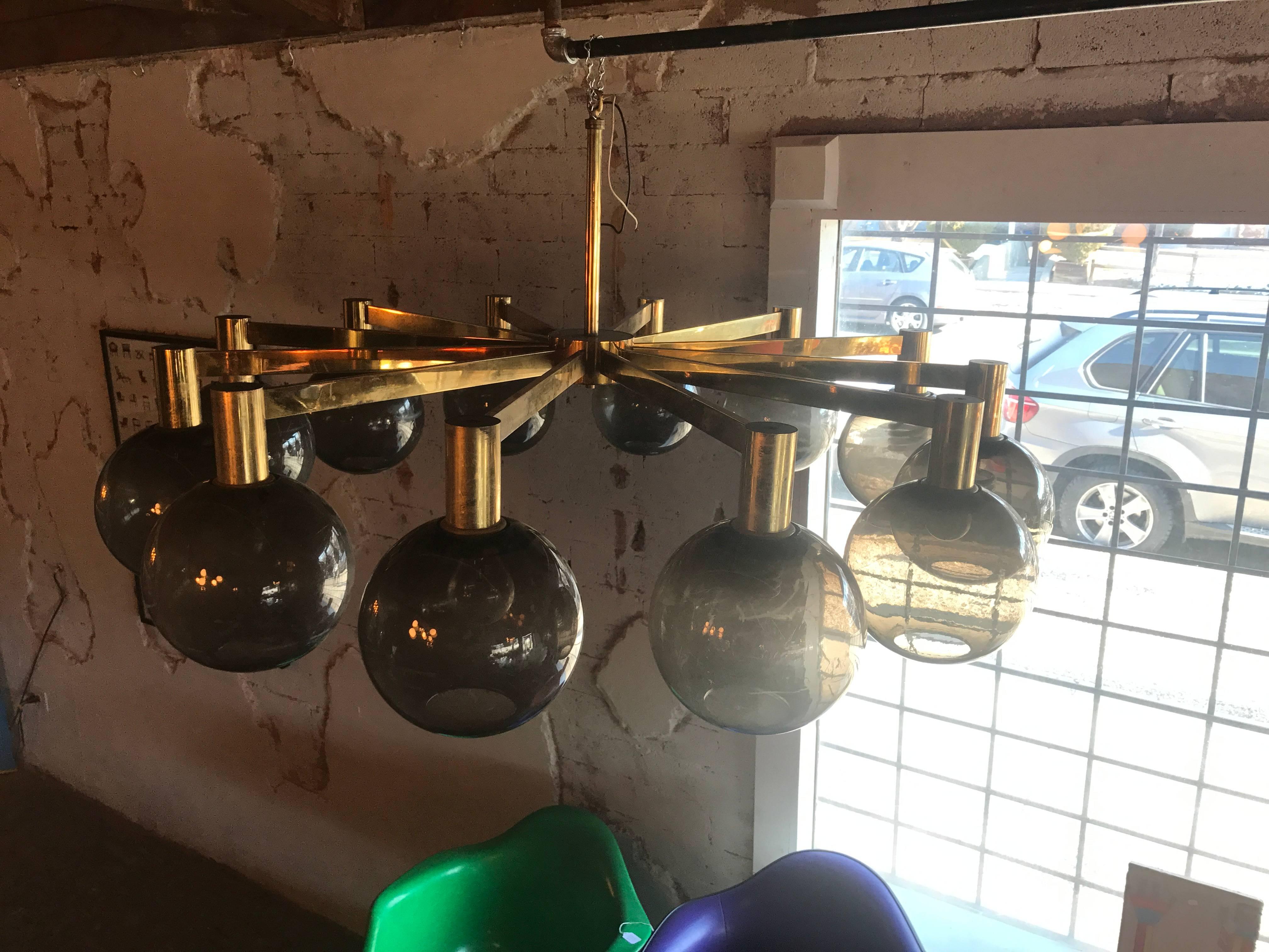 This chandelier is very large in scale
it does need to be cleaned up and possibly re-wired as desired
most the lights do come on
it is in great vintage condition
the frosted globes are plastic and need to be cleaned.

         