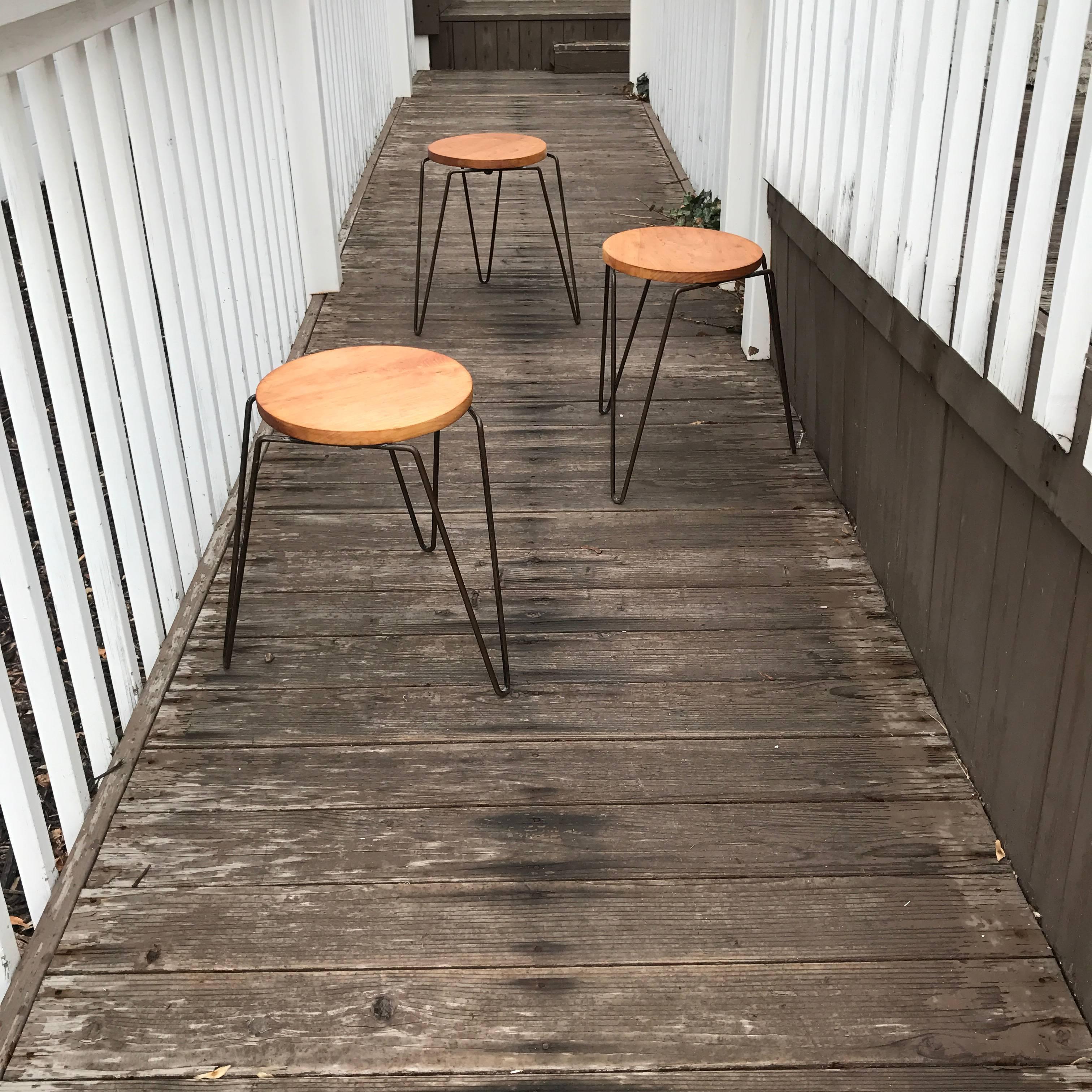 Set of three Florence Knoll model 75 hairpin iron leg stools. In original condition.
  