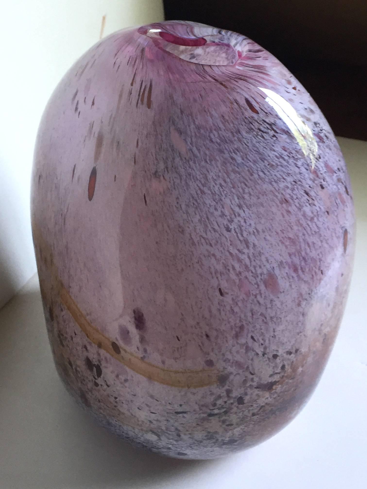 Fine contemporary studio blown glass vase of organic ovoidal form, with dynamic whirling flecks of brown, rust and yellow in the body, with uncurvate mouth, circa 1990.

Indistinct signature to base. From a Mid-Western private