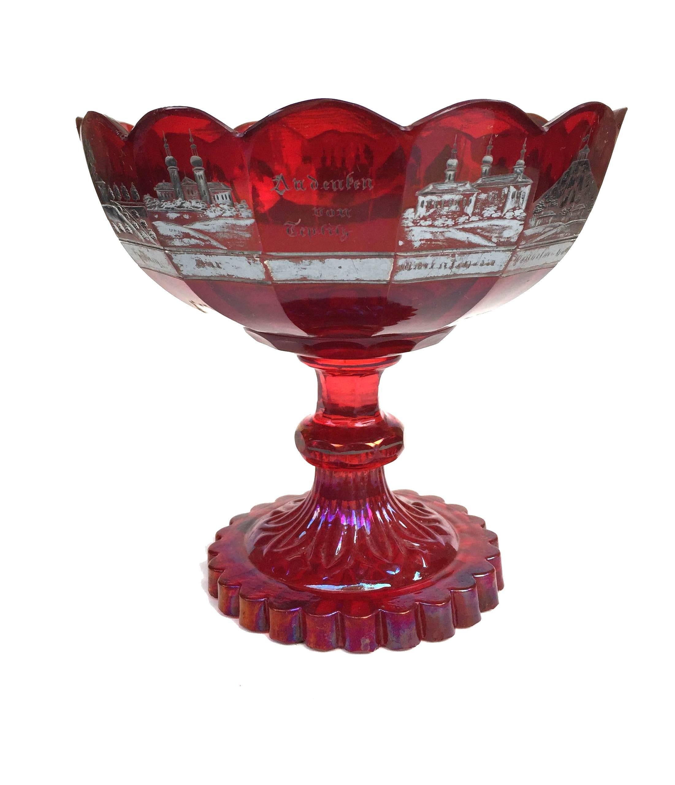 Czech Bohemian glass silver-resist ruby-stained souvenir compote, the bowl of scalloped form, with silver resist scenes of the touristic highlights of Teplitz, featuring individual important buildings in 13 of the 14 panels, the center panel titled