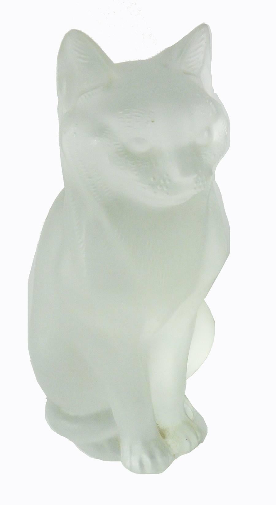 French Lalique Art Deco figure of a cat, called Chat Assis, the cat facing forward with ears pricked up, the tail delicately wound toward the right back. The model first designed during the Art Deco period of the 1930s, but so popular as to still be
