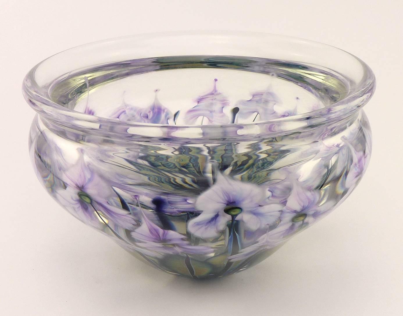 John Lotton Contemporary Studio glass blown glass bowl dated 1999, the cased, colorless glass bowl with lightly-everted mouth, waisted neck, steeply-tapering to the foot, decorated with multiple purple and white cymbydium orchids on green-yellow