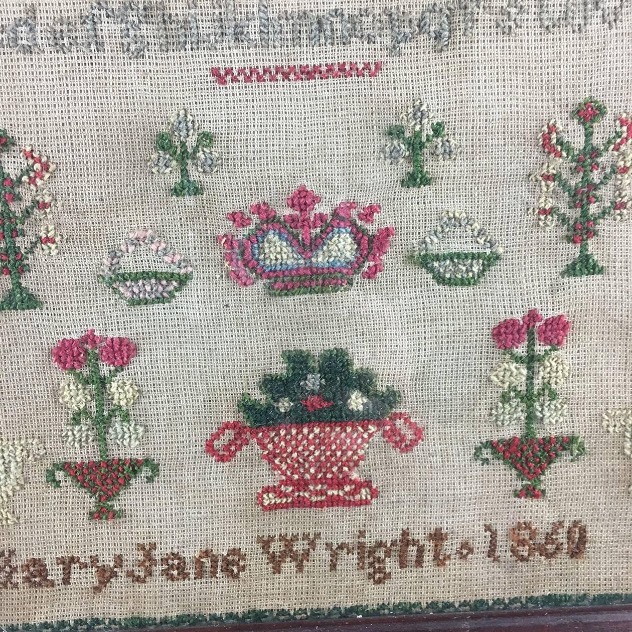 American Mid-Victorian Folk Art children's sampler dated 1860

The nearly square sampler with a full alphabet both in capitals and lowercase, numbers 1-9, multiple baskets of flowers, flowers, and a crown to the center. 

Signed to the lower