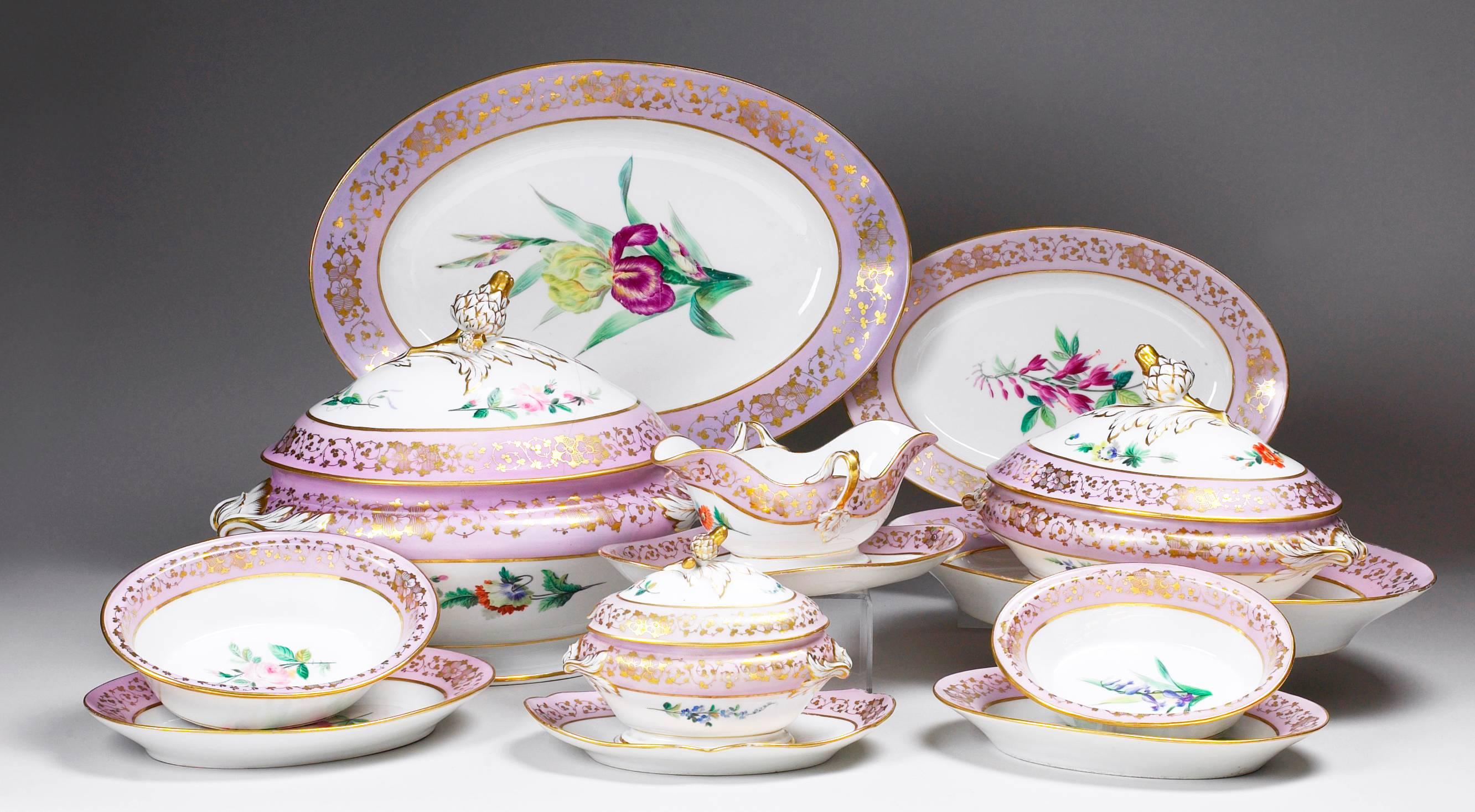French Haviland Limoges dinner and dessert service,
the rims painted with delicate scrolling gilding to the borders, enclosing,
paintings of fruit or floral specimens, the covers molded with acorns,
picked out in gilding, unmarked, circa