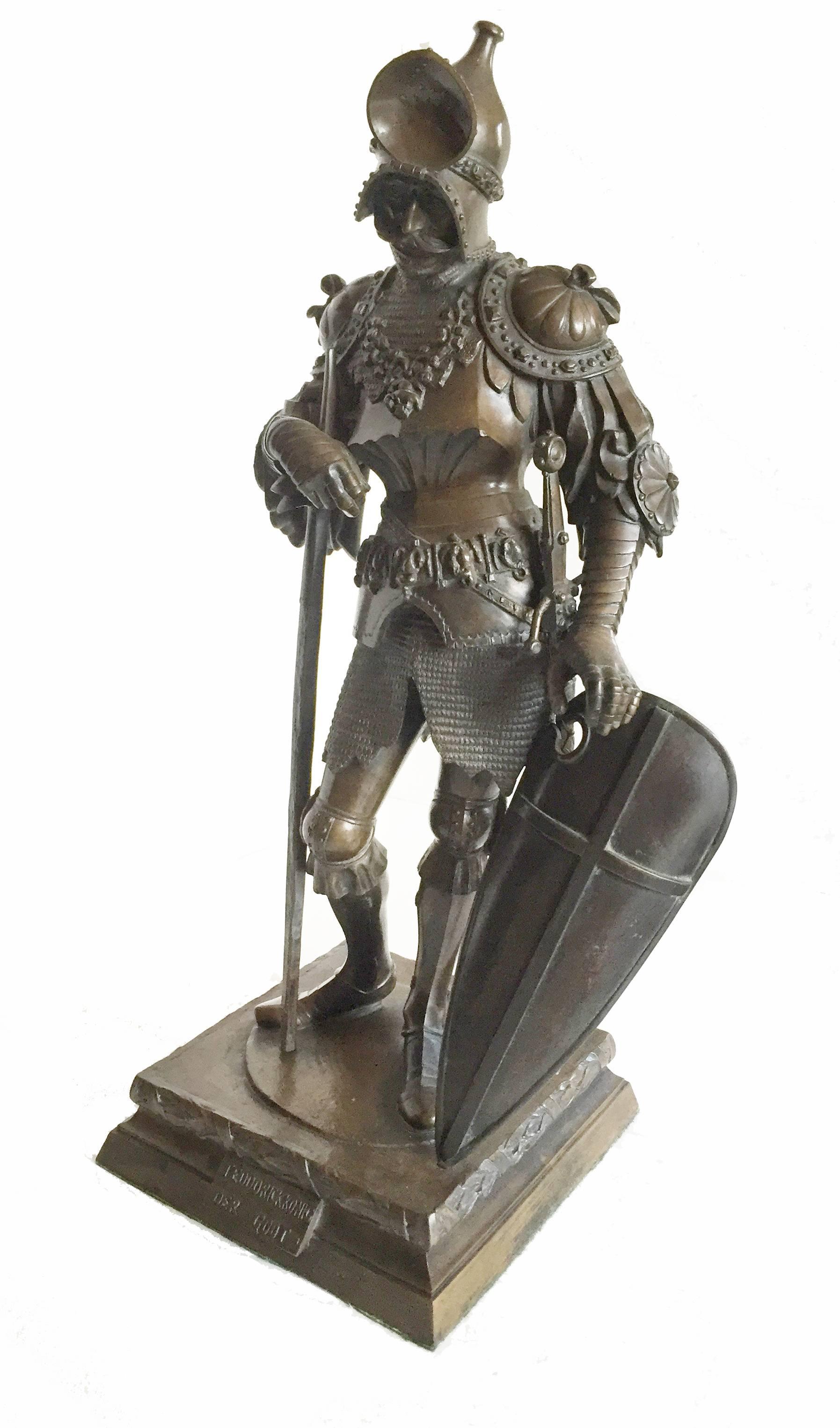 20th century continental bronze figure of Gothic king Theodoric after the artist Peter Vischer, the king shown as a standing knight, wearing armor and holding a halberd and shield, the plinth base inscribed with the subject's name, the artist, and