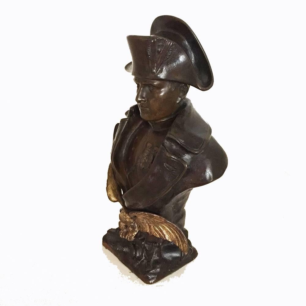 O. Ruffony Paitnated Bronze and Gilt-Bronze Bust of Napoleon 20th C.

The emperor shown in military dress, with hat, open coat to reveal his military honors, the base of the bust above a gilt-bronze spead-winged eagle. Signed to the back lower area