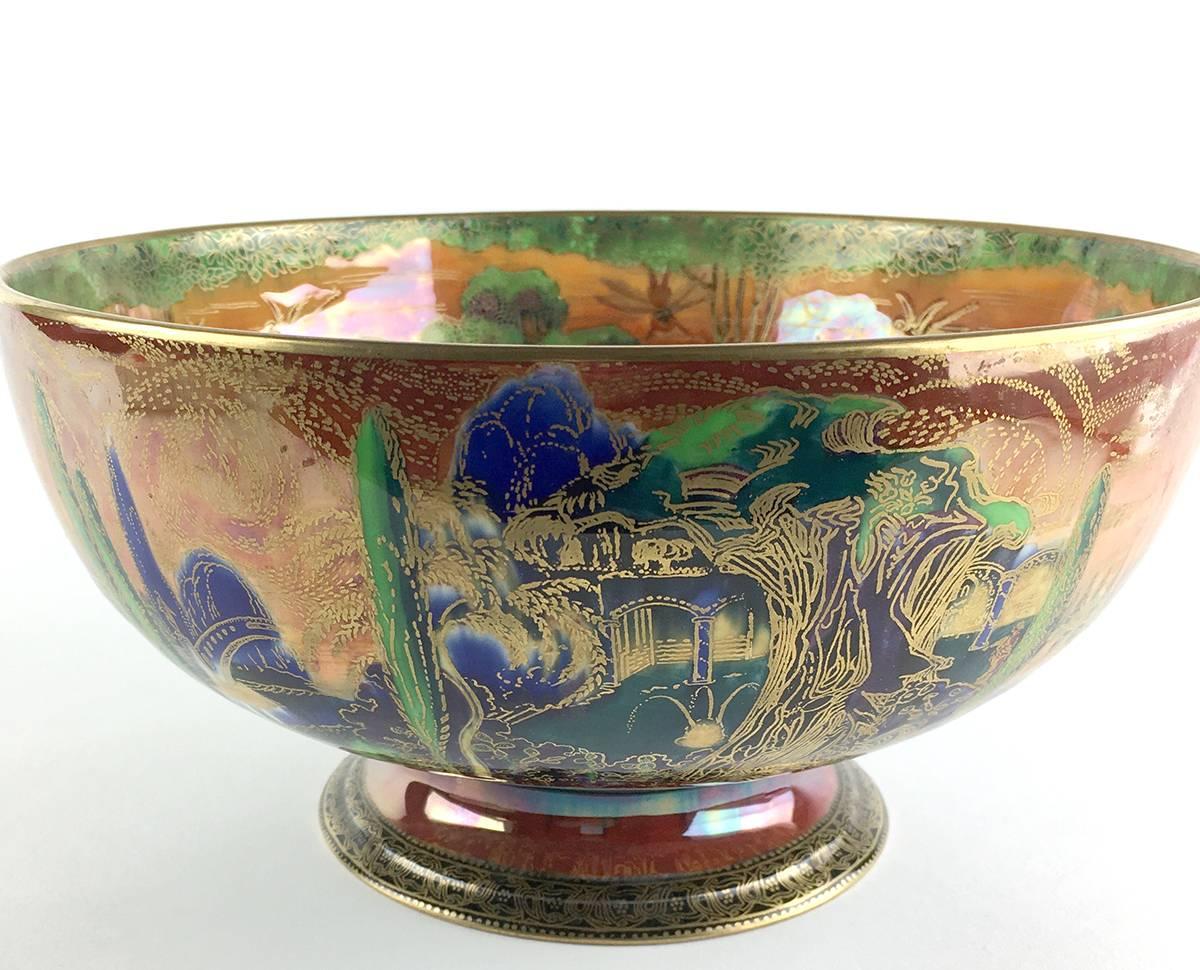 English Wedgwood porcelain fairyland Lustre punch bowl on foot, the interior painted with 