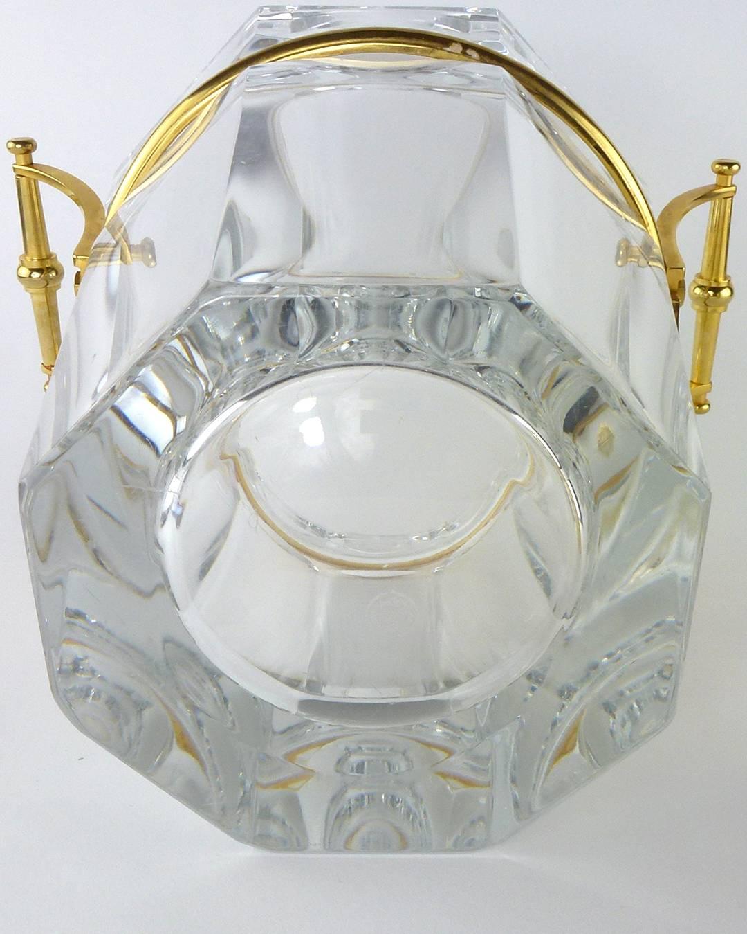 Baccarat crystal harcourt pattern Moulin Rouge Champagne cooler with gold trim, handles and liner, the hexagonal body with squared stirrup-style handles, pierced cylindrical bottle holder and trim in gold. 

This is the ultra luxurious champagne
