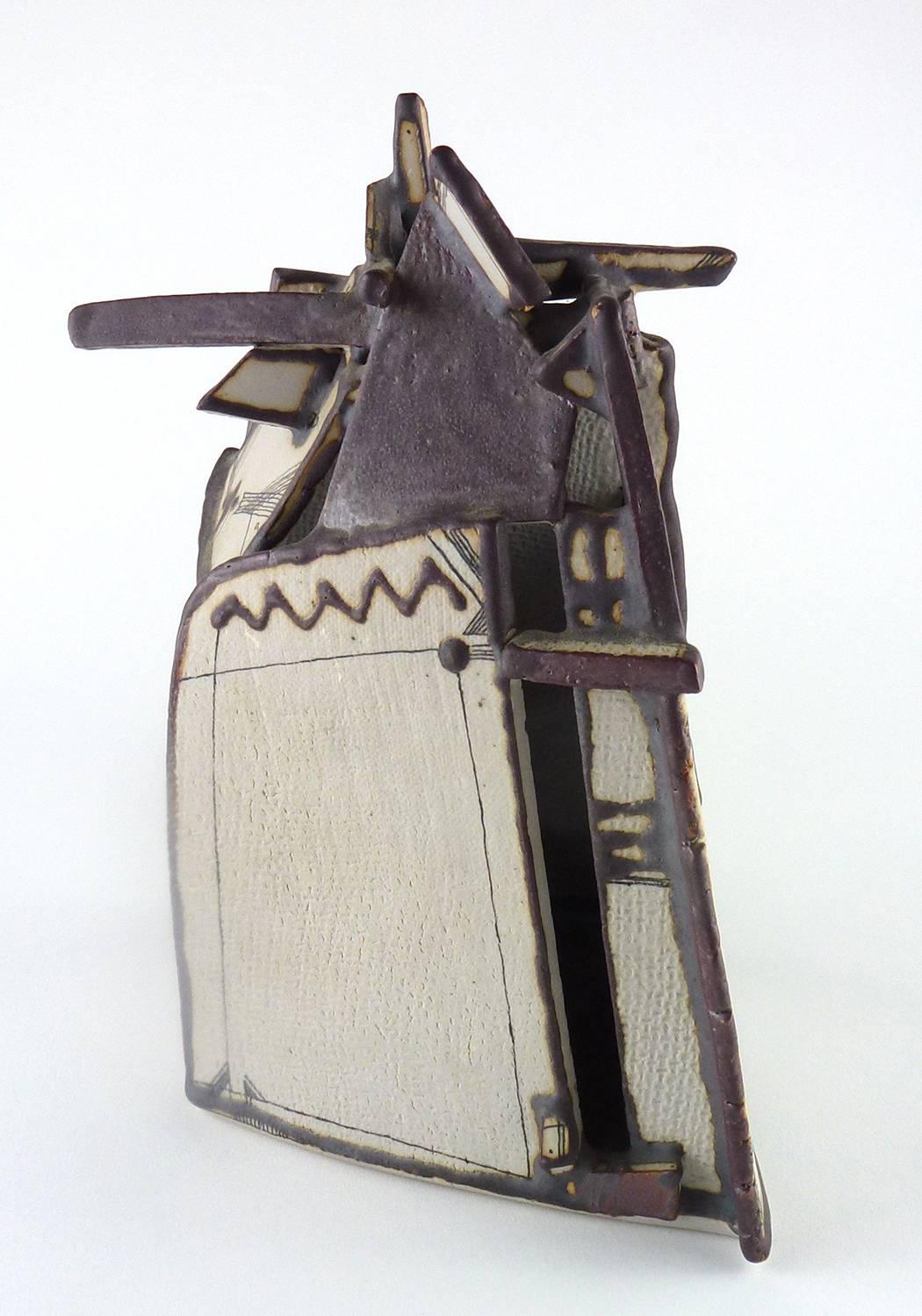 Peteris Martinsons (Latvia, 1931-2013) contemporary studio pottery slab-constructed tower, the tapering rectangular and irregularly-formed structure topped by a cluster of beams or bars painted brown, the body enamelled in black ink with linear