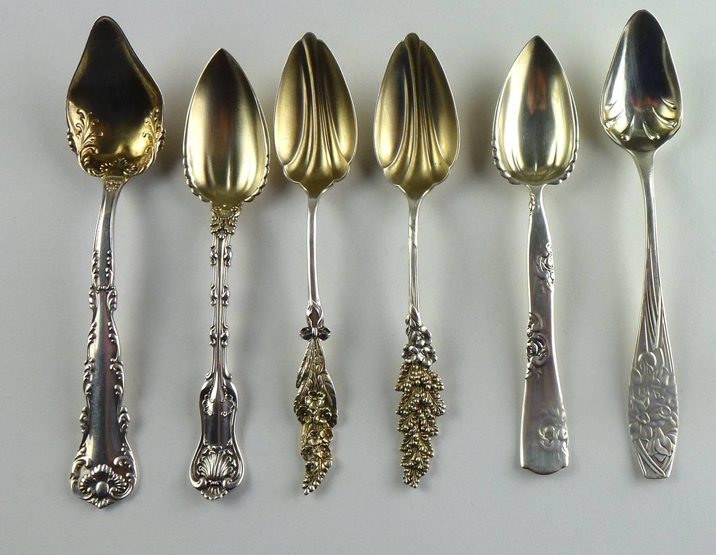 Harlequin set of six sterling and sterling with gold-wash grapefruit spoons, each with a different handle design, including Japanesque iris floral; Imperial Queen and Louis XV by Whiting. 

Put together as a set by a creative tablescaper, this