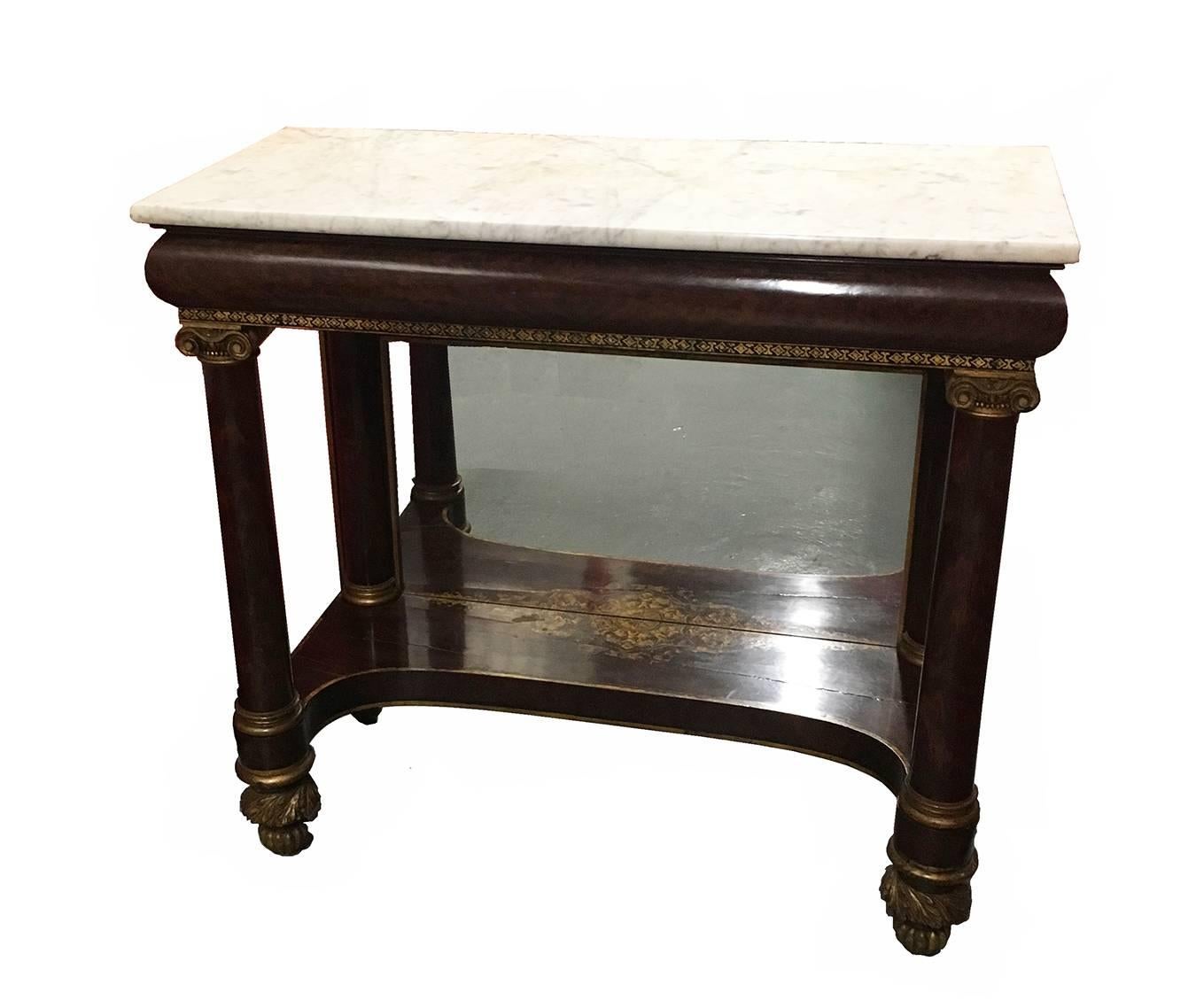 New York Classical pier table with marble top, water-gilt stenciled scroll decoration to the mahogany ground, with white pine and poplar secondary woods, the rectangular frame with four columns topped by carved scrolls, with carved ankles and melon