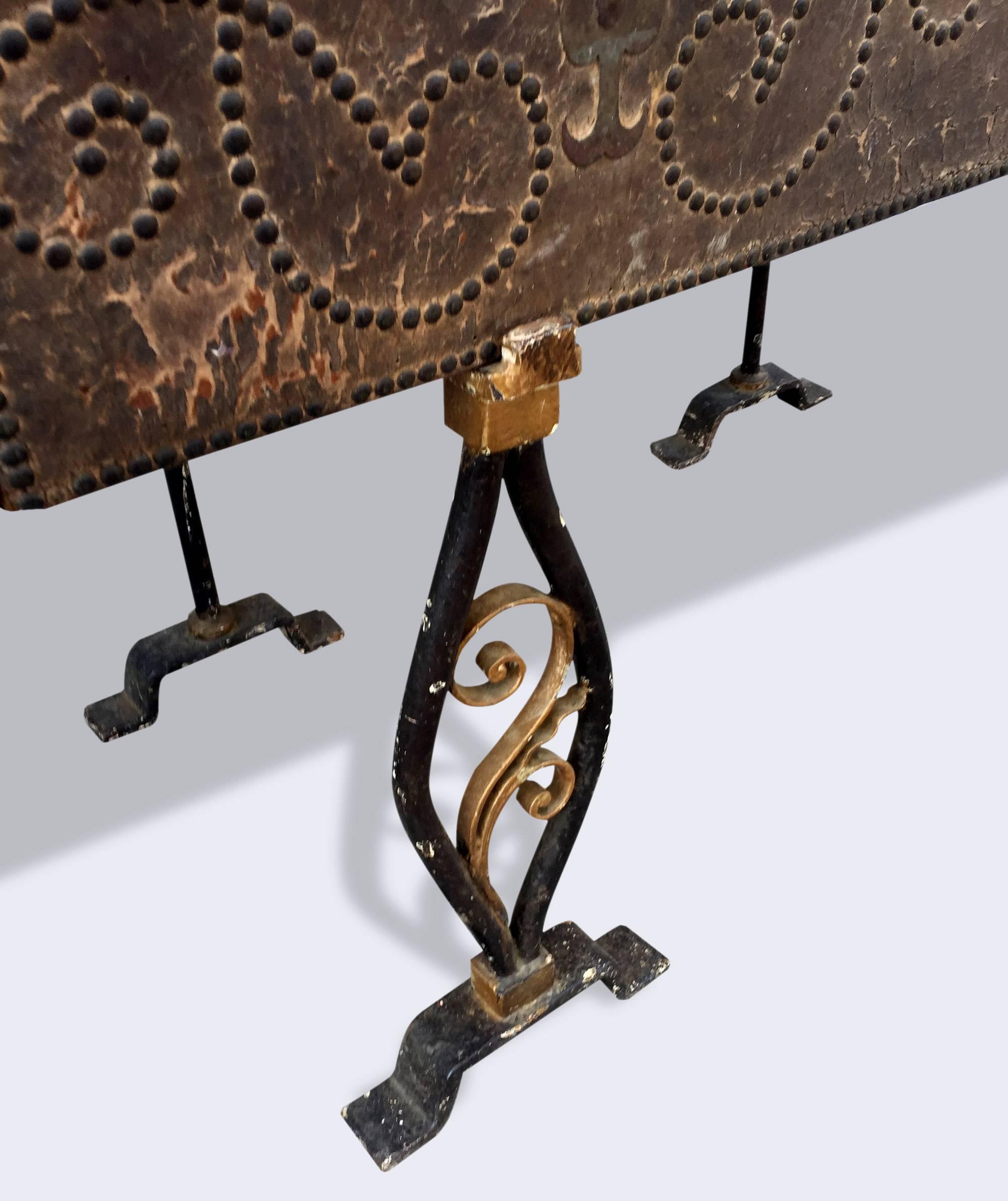 A Late 17th Century English Leather Trunk on late 19th Century Cast Iron Stand with studded detail. 