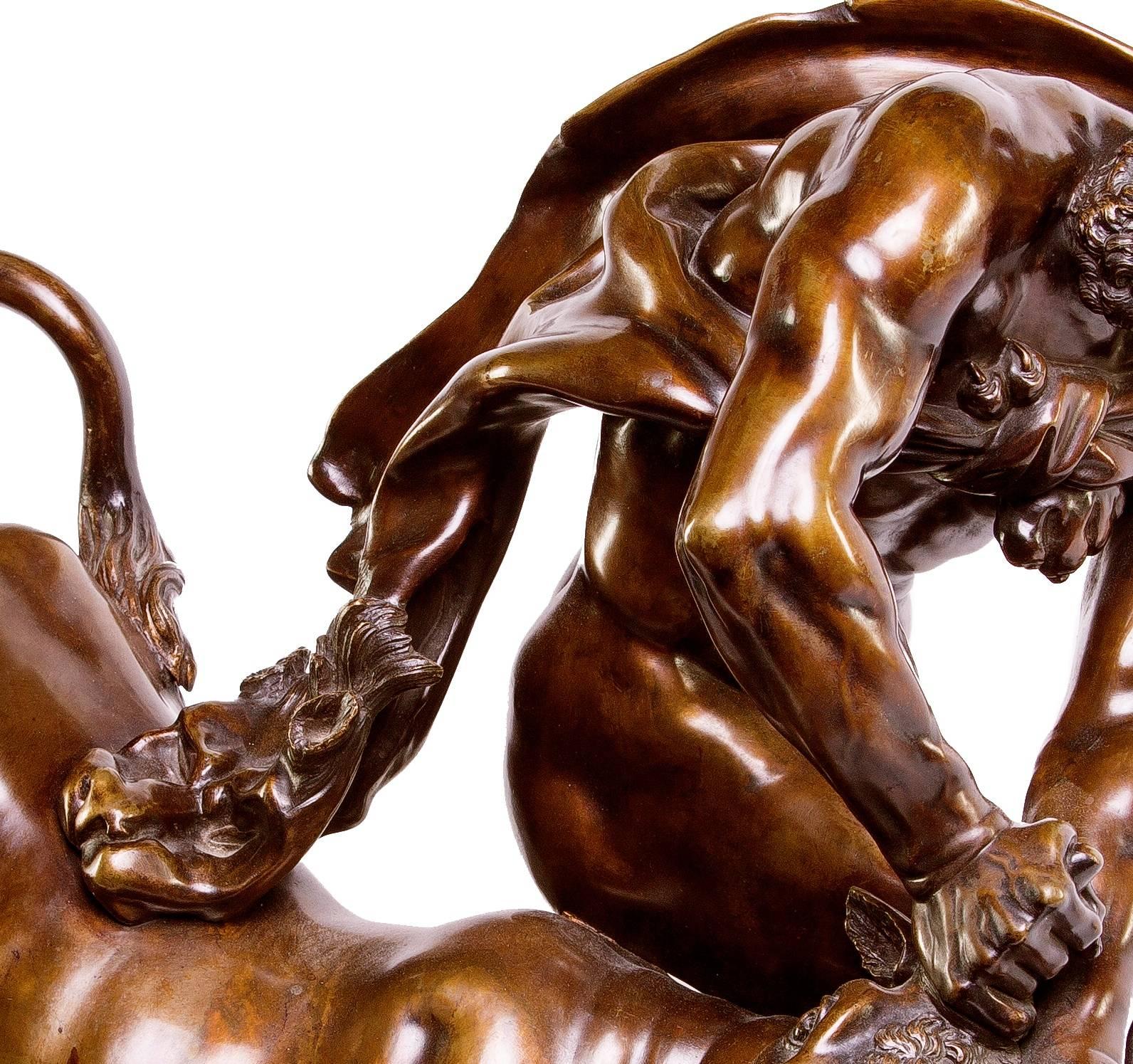A large French bronze depicting Hercules wearing the pelt of the Neiman lion, wresting with the Cretan bull, which was two of the twelve labors of Hercules in Greek mythology.