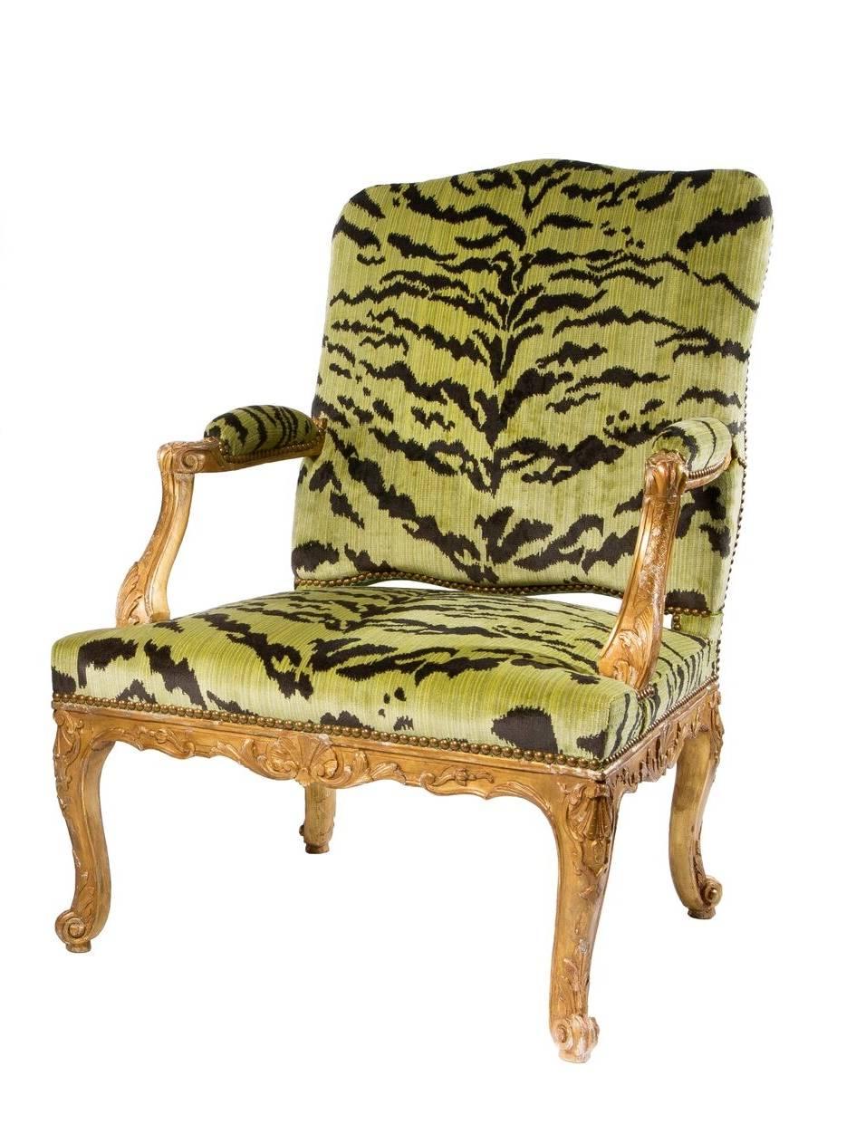 A fine pair of Louis XV style giltwood Fauteuils in a green silk tiger velvet.
