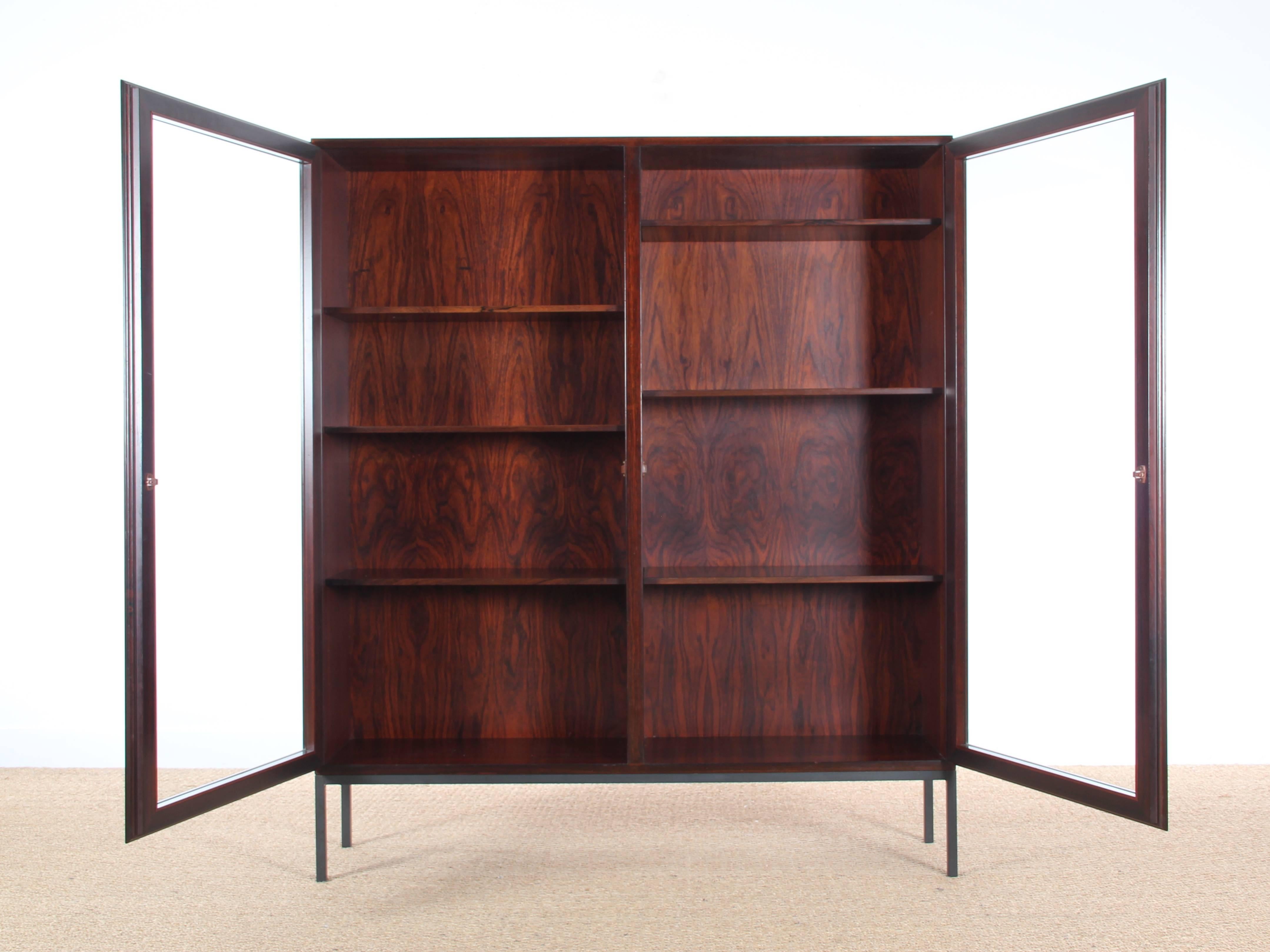 Library showcase duplicate rosewood for Omann junior, six adjustable shelves, mounted on black lacquered metal legs. Very nice finish.