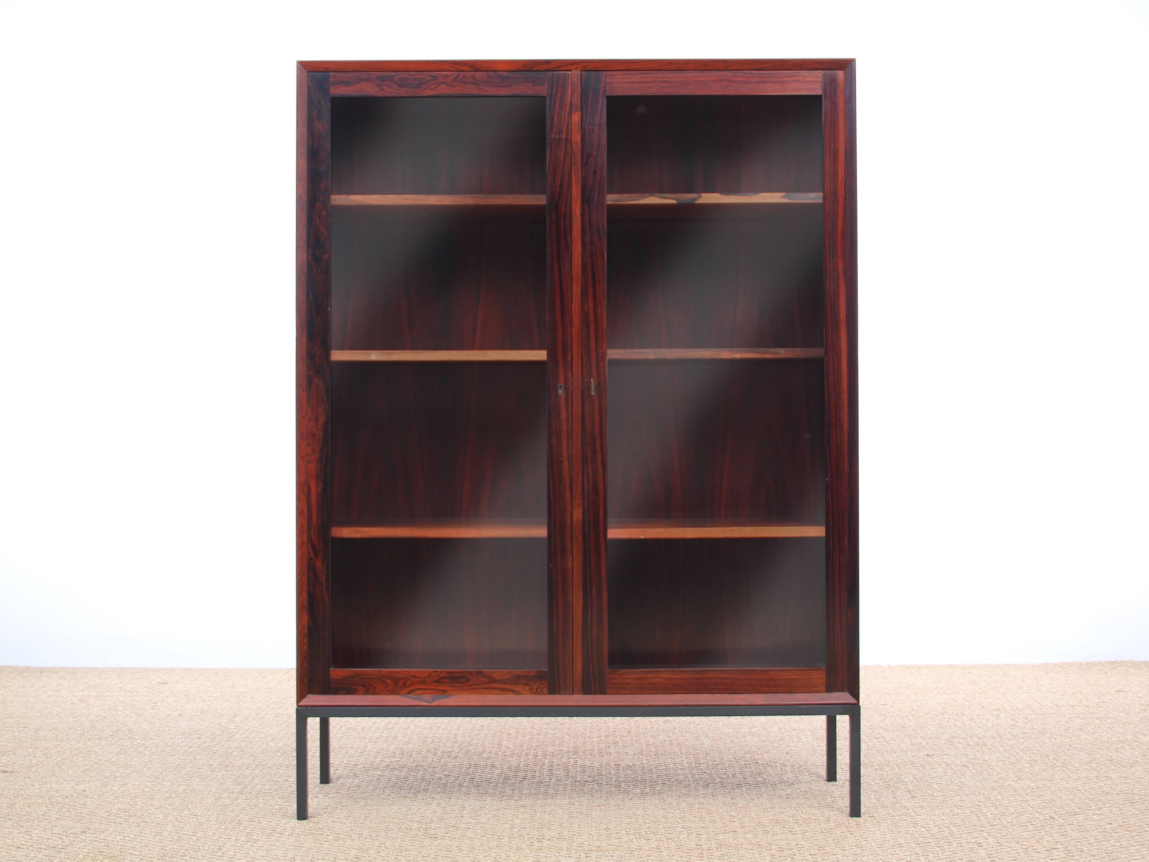 Danish work. Scandinavian showcase rosewood. Steel base. Adjustable shelves. Bevelled edges. Two rooms available. Price indicated for one showcase.