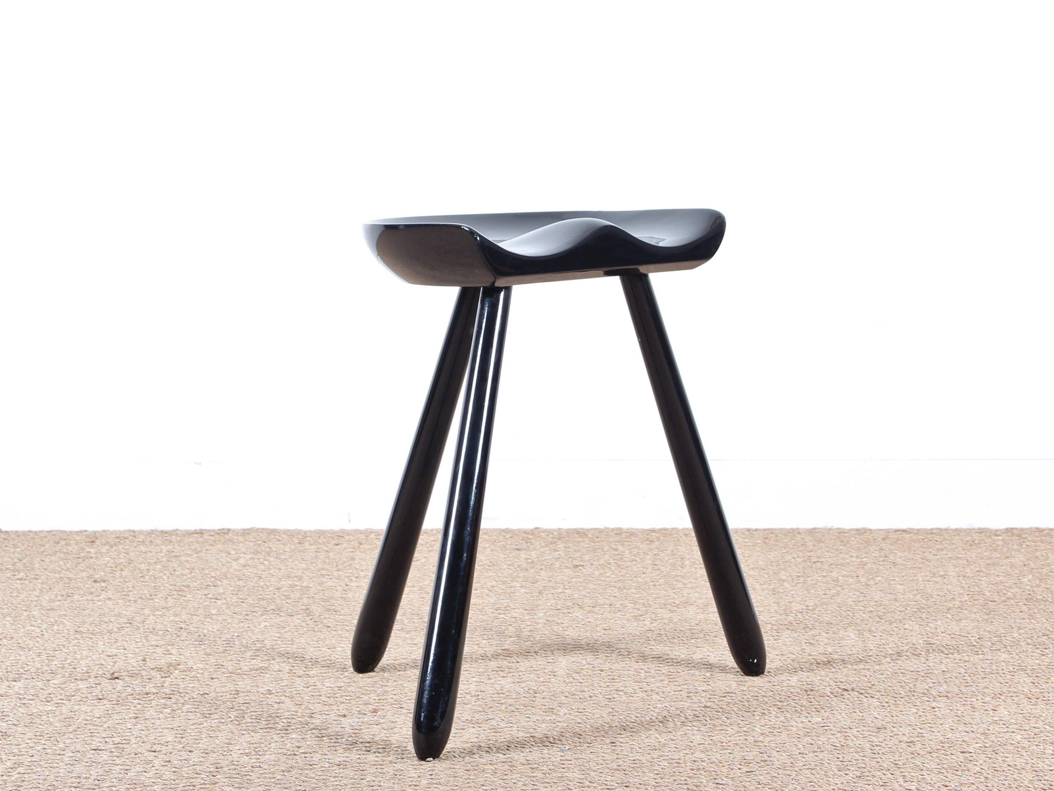 Danish tripod stool or "milking stool" in the spirit of Mogens Lassen. Solid beech black pimp. Two small paint chips at the bottom of the feet.