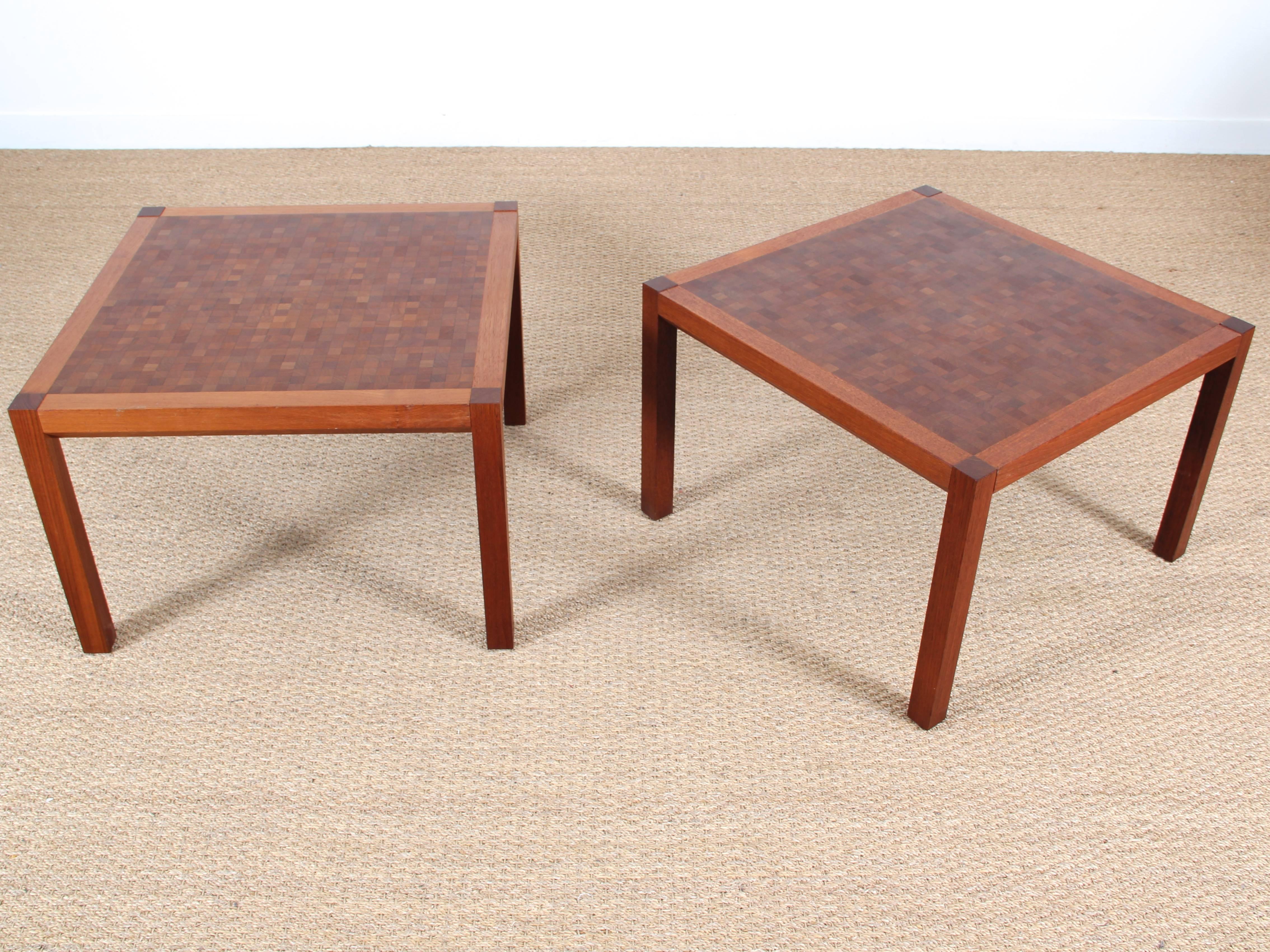 Mid-Century Modern pair of coffee table in teak by Rolf Middelboe & Gorm Lindum with a bitmap structured table top, made of cubical solid pieces of teak combined to create an interesting structure and pattern. All table is unique and get a serial
