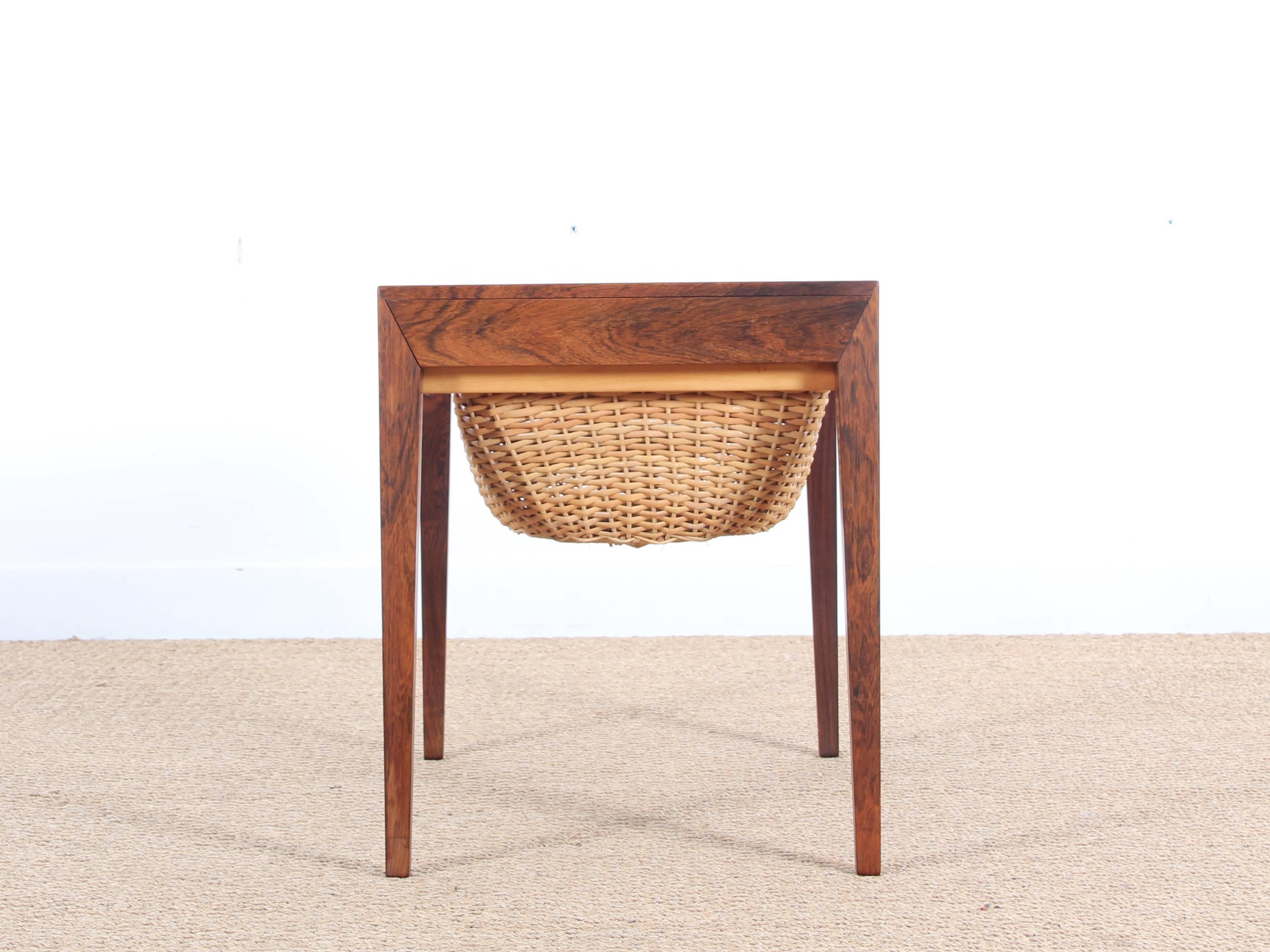 Worker Danish rosewood Rio Severin Hansen. Sliding basket with wool pelottes. Needle drawer retracted into one of the sides. 