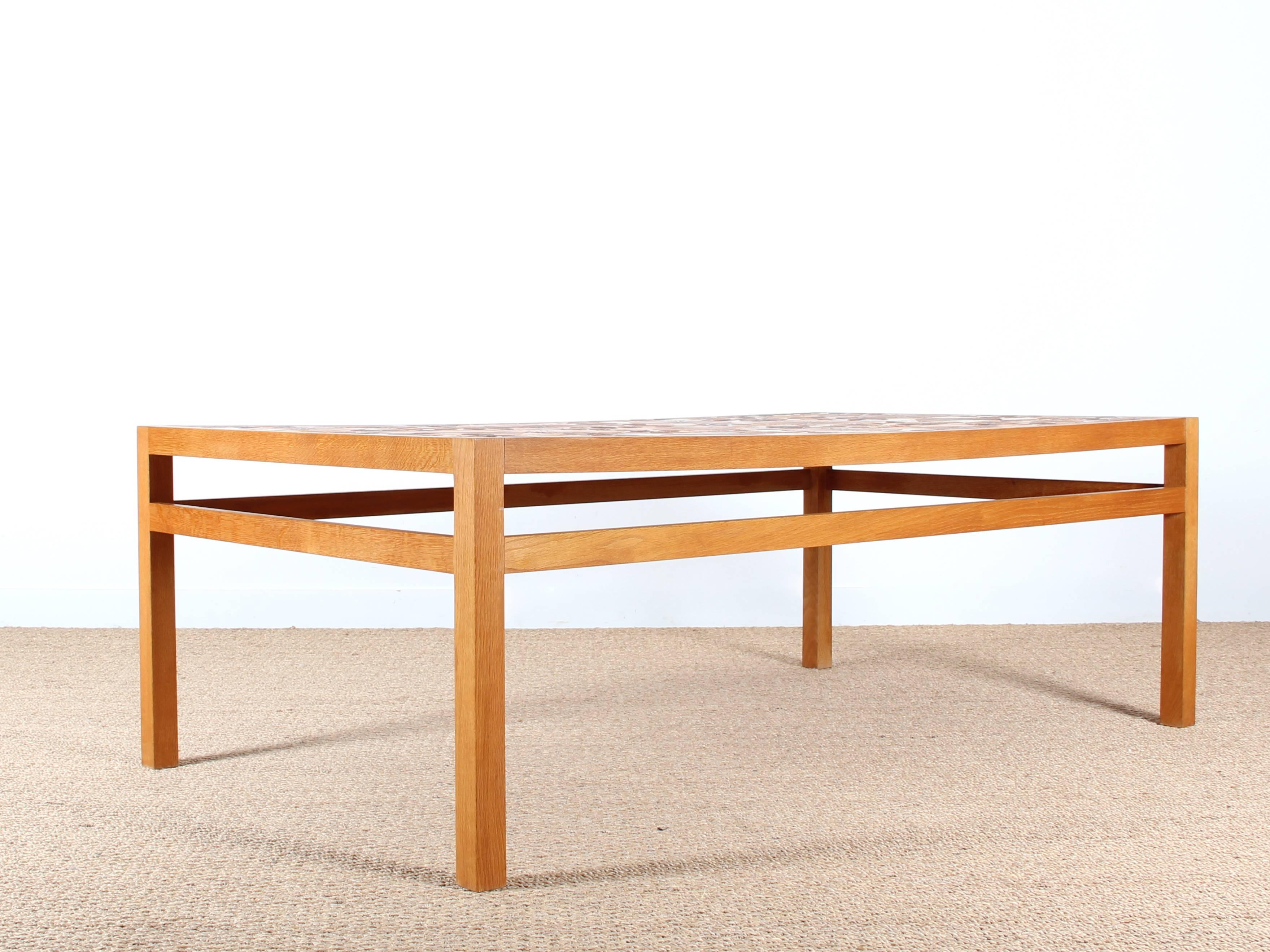 Monumental oak coffee table covered with ceramic by sculptor and ceramist Tue Poulsen. Geometric patterns in orange brown, incised on grog.

Tue Poulsen has produced a series of coffee tables in ceramics, but each is unique. Signed.

Model