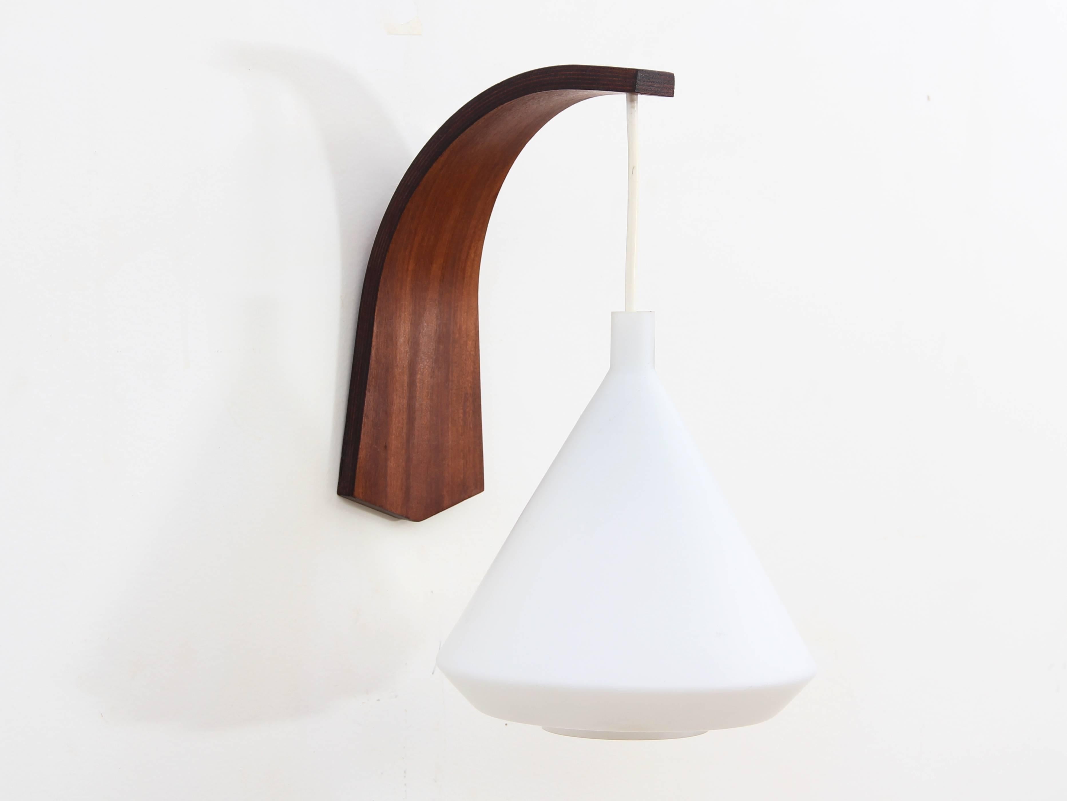 Mid-Century Modern pair of wall lamp in teak and opal by Philips. New electrical system brought up to EU standard. E27 bulb. Price for the pair.