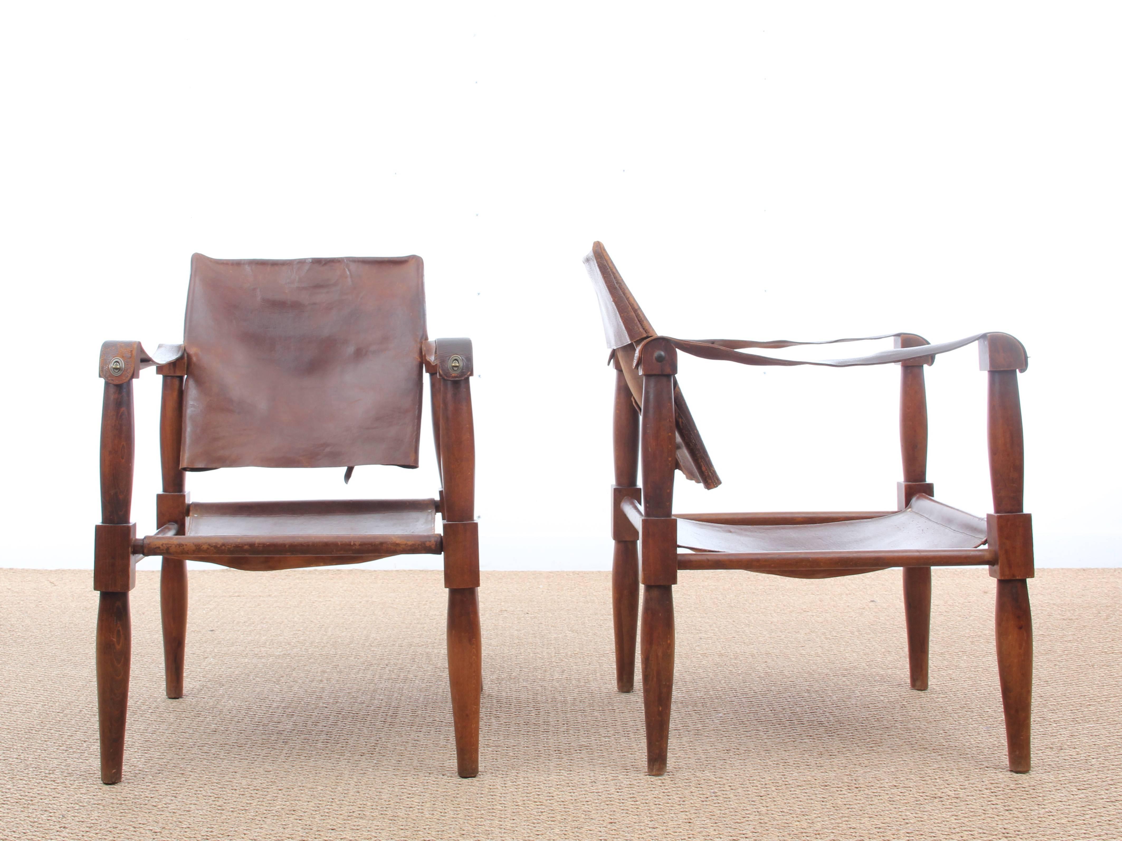 Pair of safari chairs in beech and brow patinated leather. Unknown designer. From the 1940s. Comes with scratch and cracks. Price for the pair.