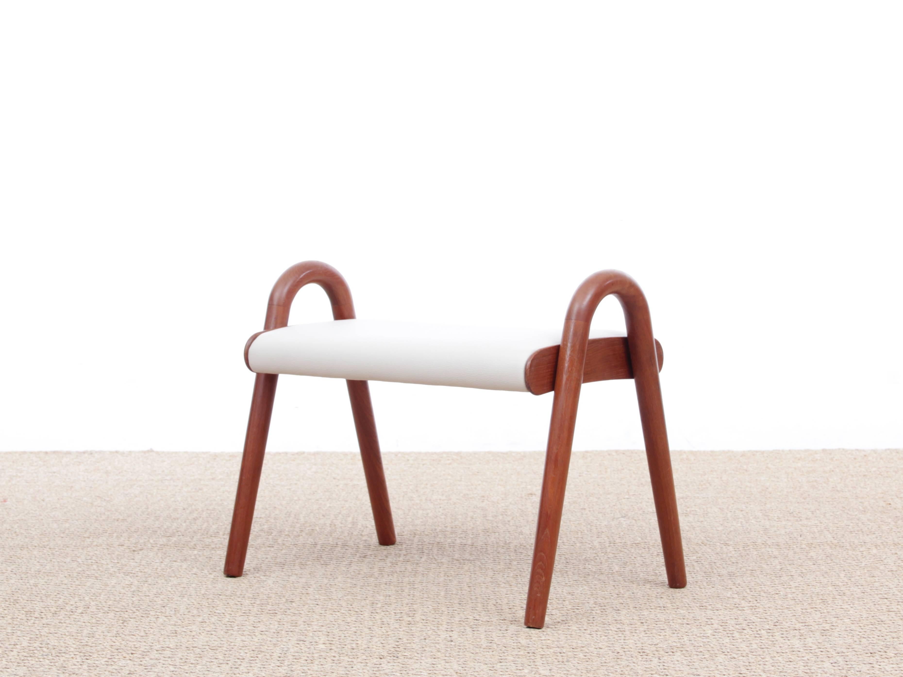Mid-Century Modern Scandinavian foot stool by Vilhelm Lauritzen. Solid teak. Newly reupholstered in Ivory leather.
