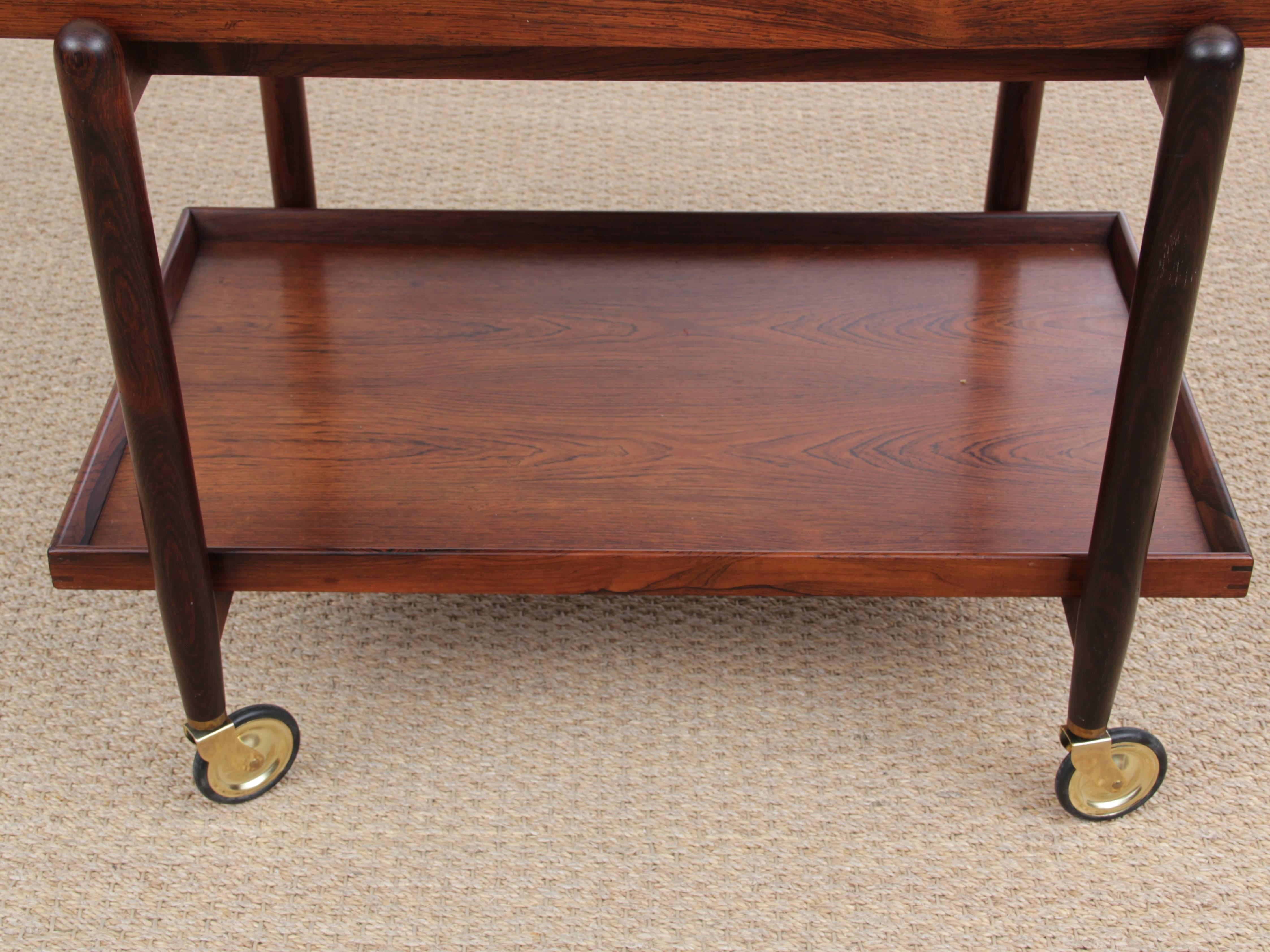 Midcentury Danish serving cart in rosewood by Poul Hundevad with extendable tray.