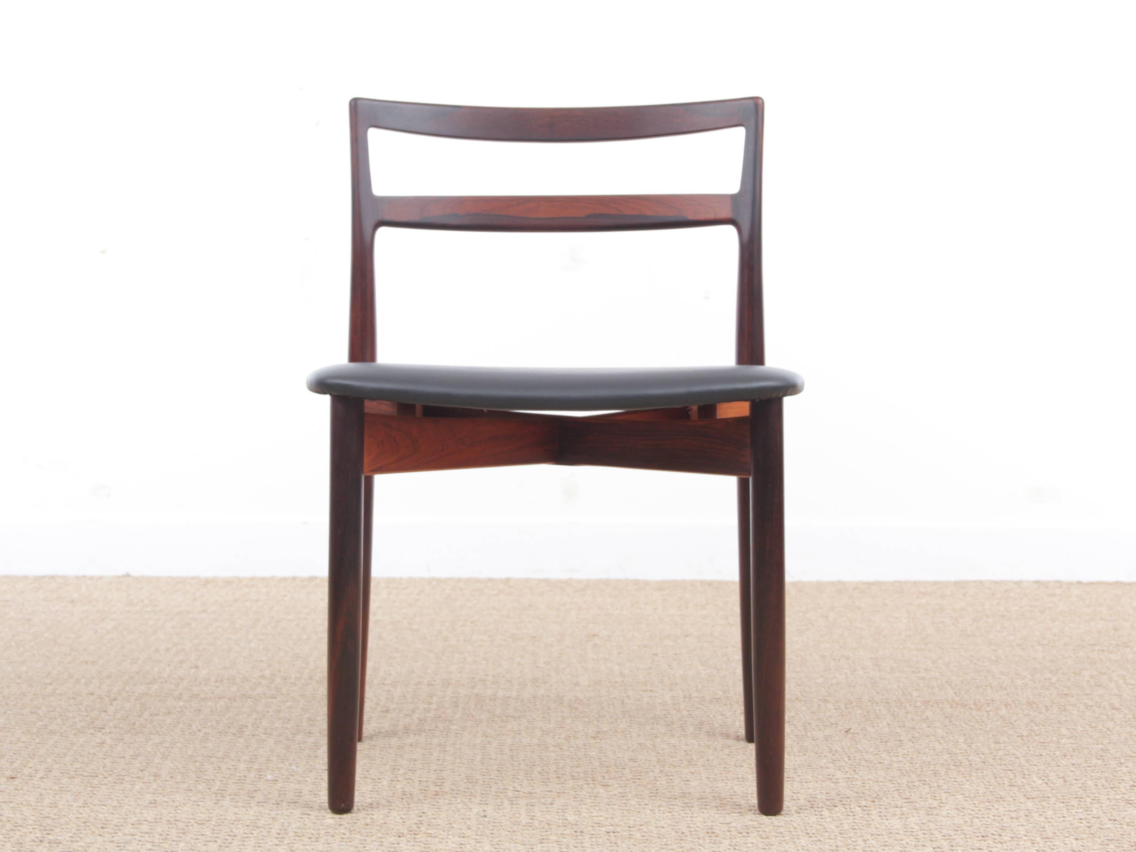 Mid-Century Modern Scandinavian set of six rosewood chairs model 61 by Harry Østergaard for Randers Møbelfabrik newly upholstered with similar black leather. Referenced by the Design Museum Denmark under number RP05862. Bibliography: Mobilia 1961.