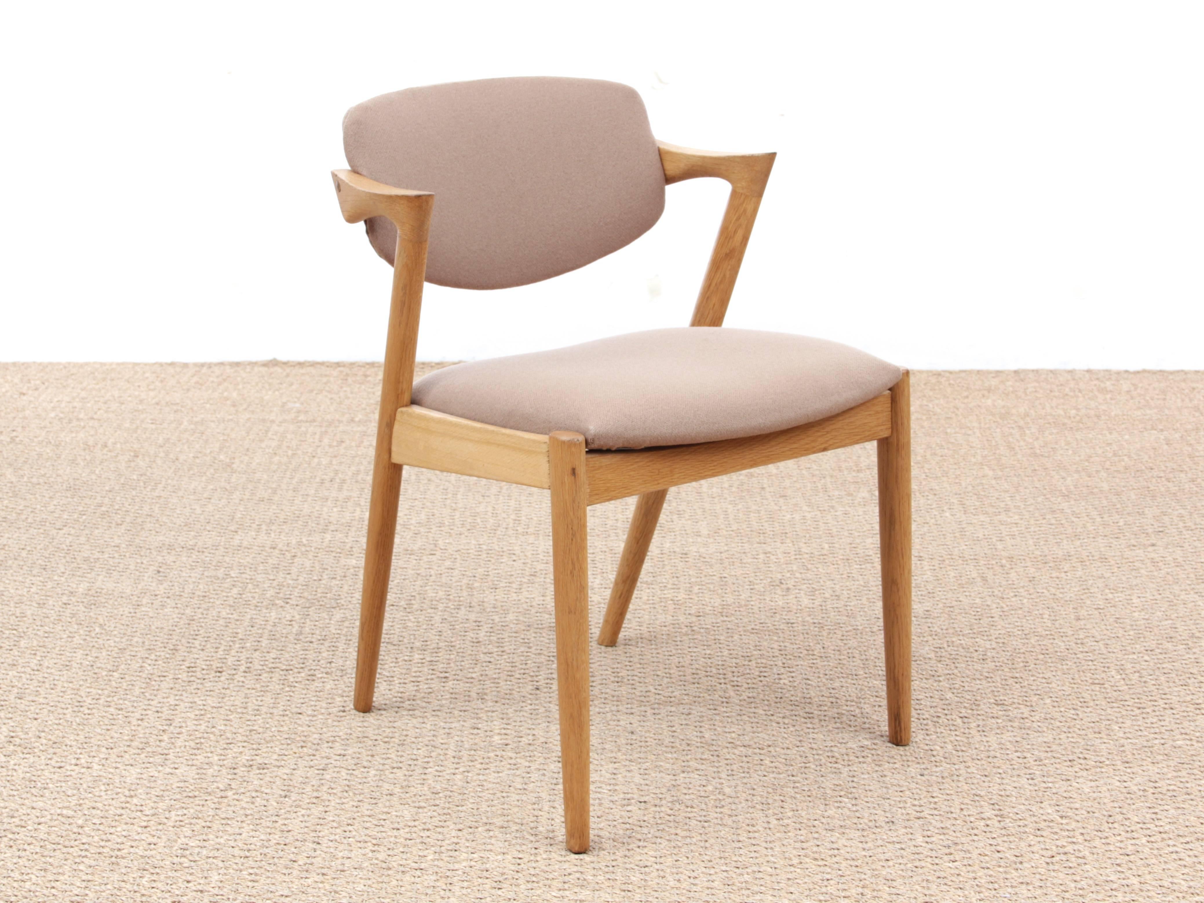 Midcentury danish set of eight Kai Kristiansen oak chairs, model 42. Original condition. Newly reupholtered with Kvadrat Tonus fabric colour #224. Referenced by the Design Museum Danmark under number RP17674. Bibliography : The furniture fair