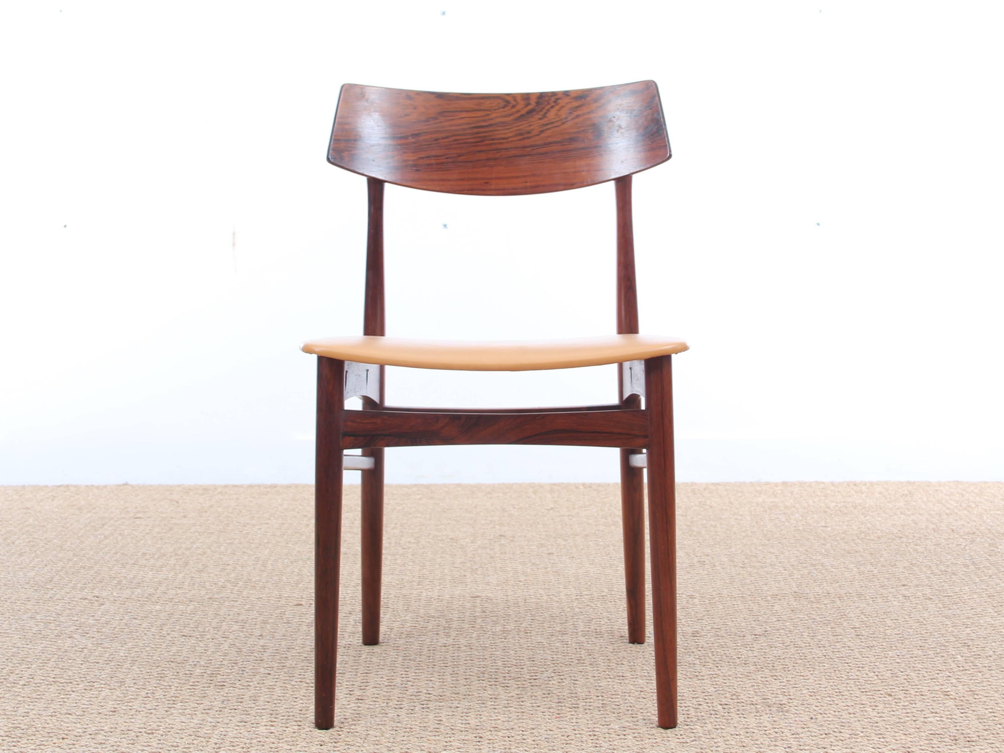 Mid-Century Modern Danish set of four rosewood dining chairs. Original leather seats. Danish work.