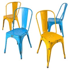 Set of 4 Tolix chairs: 2 yellow, 2 blue. 1960s edition