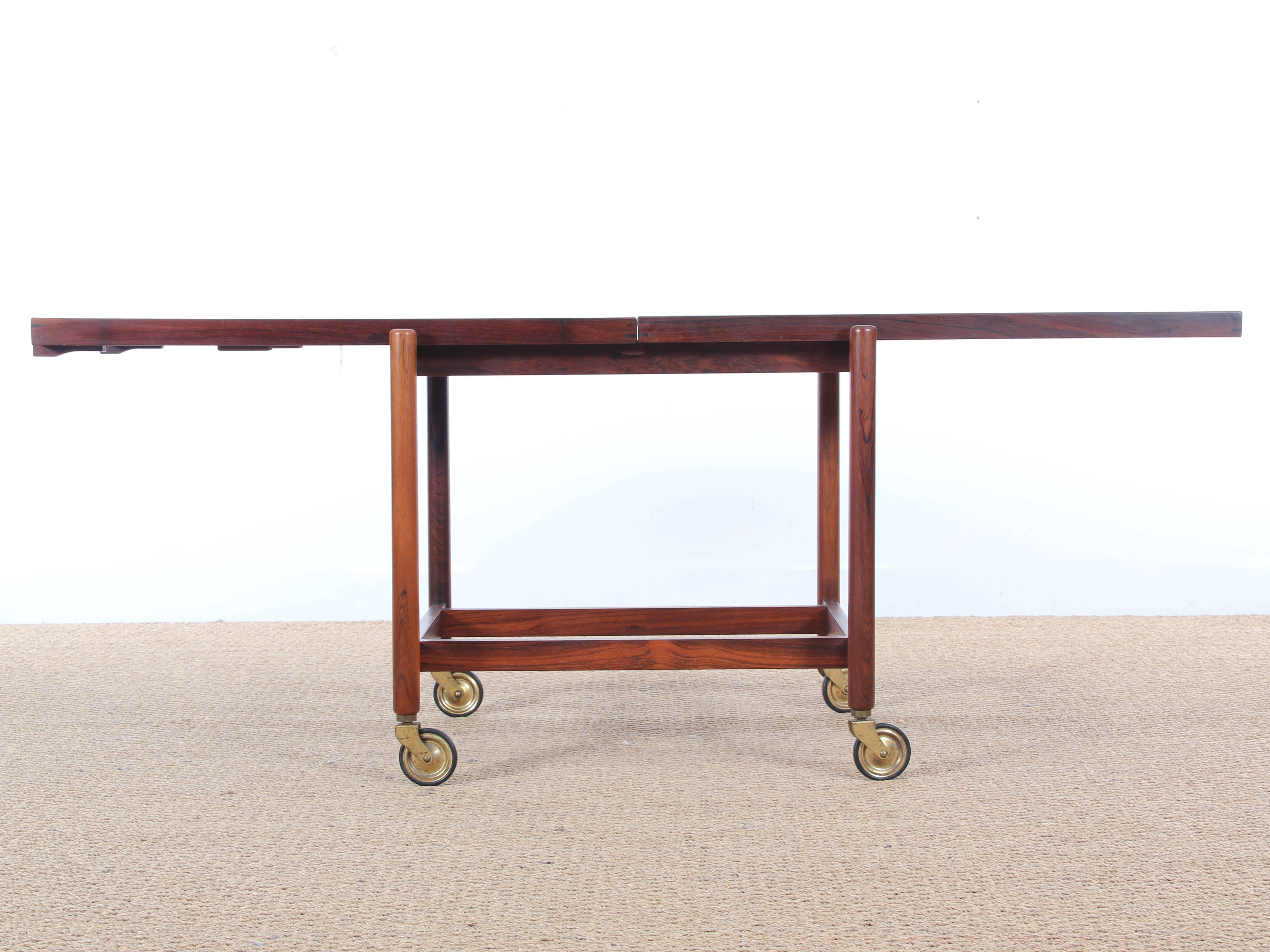 Mid-Century Danish serving cart in rosewood by Poul Hundevad with extendable tray.
