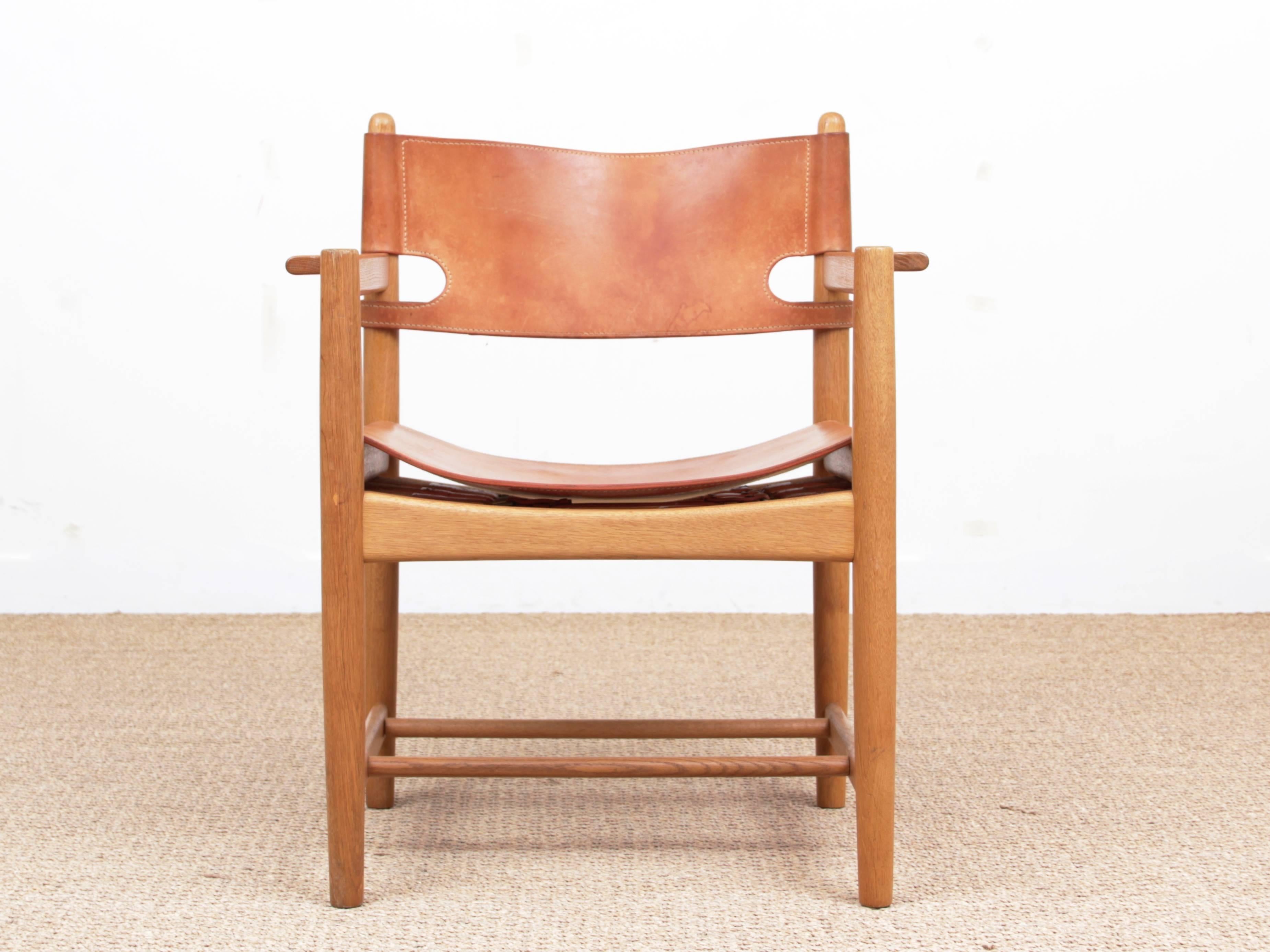 Mid-Century Modern Scandinavian pair of arm chairs model 3238 by Børge Mogensen for Fredericia Furniture. Solid laquered oak and leather. Piece bought in 1970. Initially produced by cabinet maker Erhard Rasmussen, it has been later produced by
