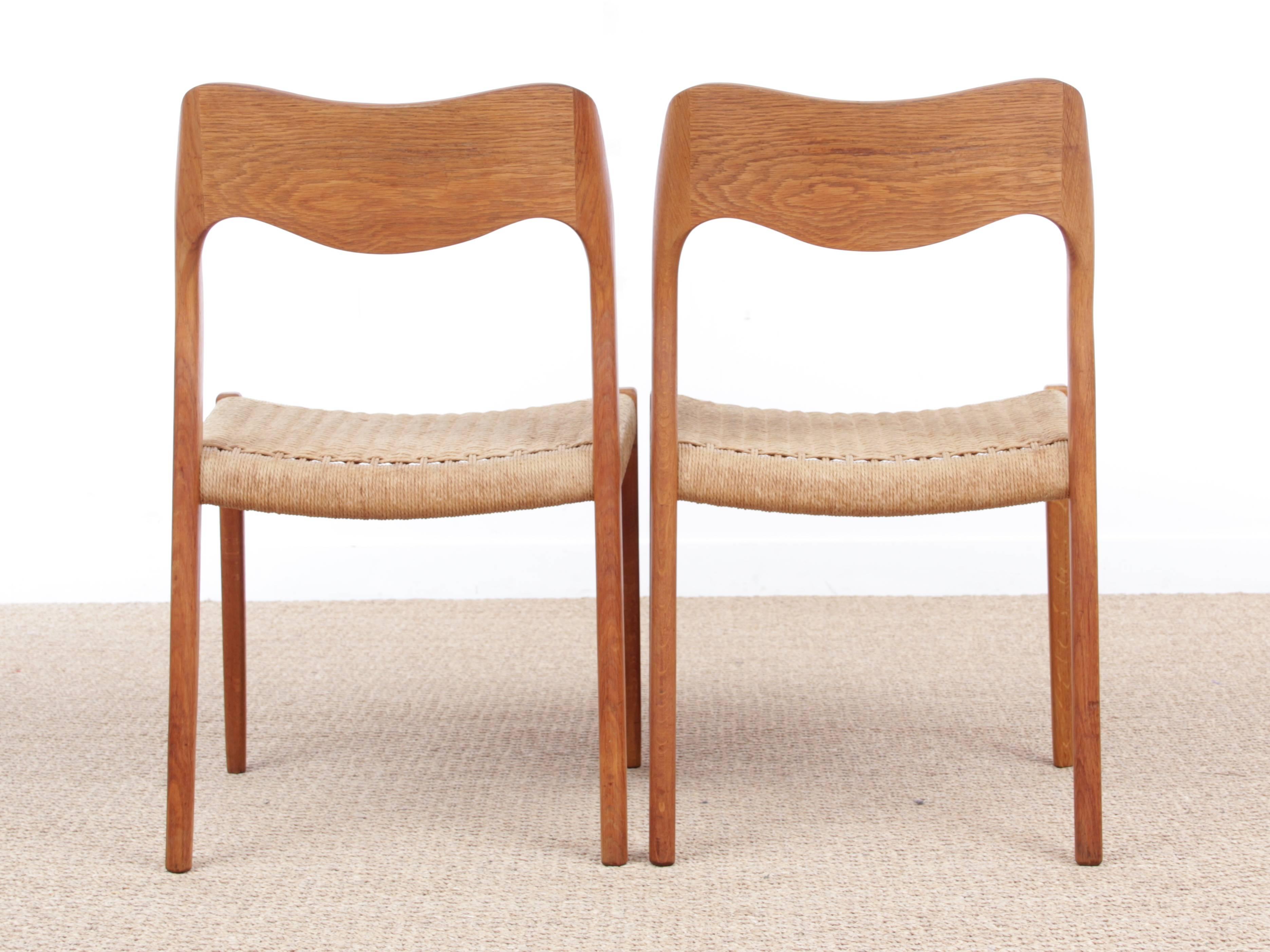 Mid-Century Modern Danish set of four chairs in oak model 71 by Niels O. Møller. Seat in papercord. Model from the 1980s. Traces of wear. Price for the pair.