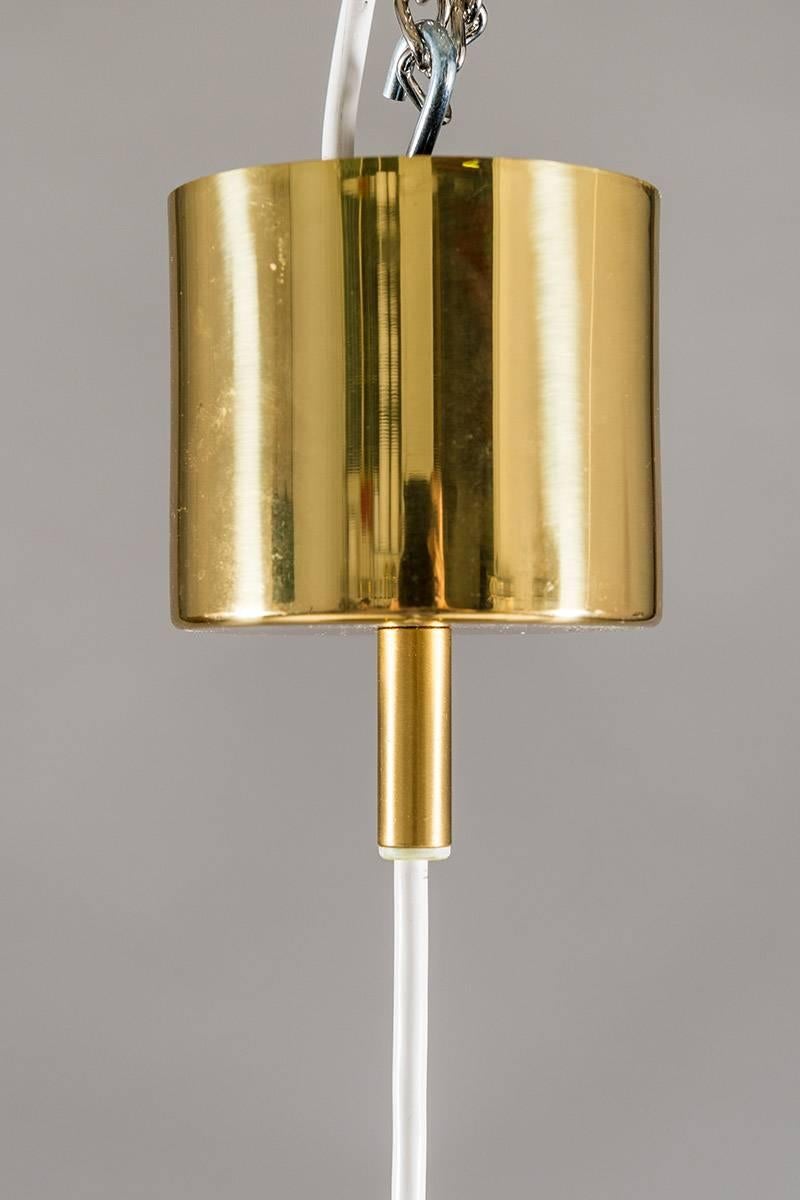 Ceiling light with brass frame and pink silk fringes by Hans-Agne Jakobsson for Markaryd in Sweden, from the Scandinavian Mid-Century Modern era.
Condition: This lamp is in very good original condition. The brass only shows minor signs of use and