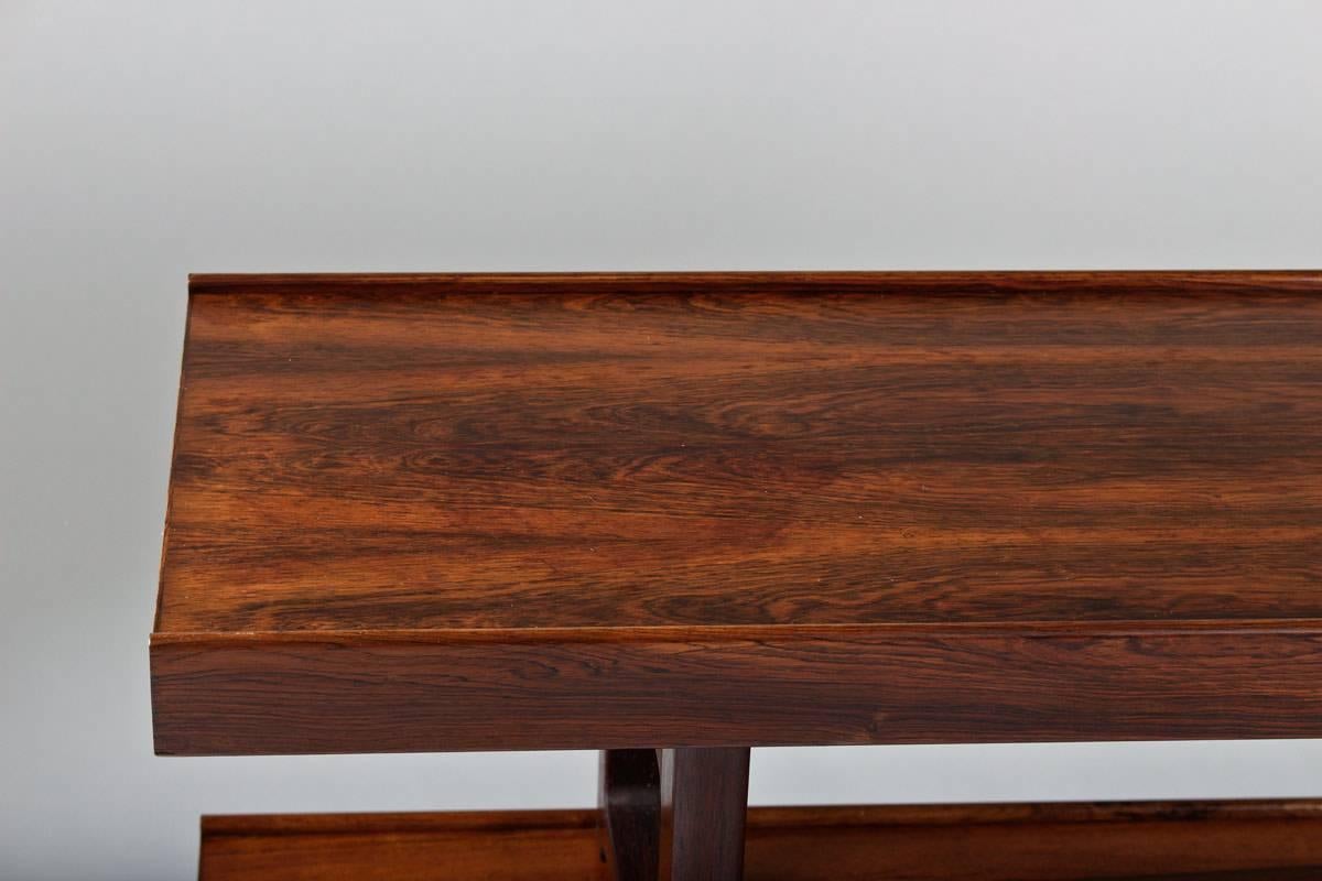 Pair of Krobo benches or side tables in rosewood by Torbjørn Afdal for Mellemstrand, Norway. 
Condition: Excellent restored condition, slightly bleached by the sun.
