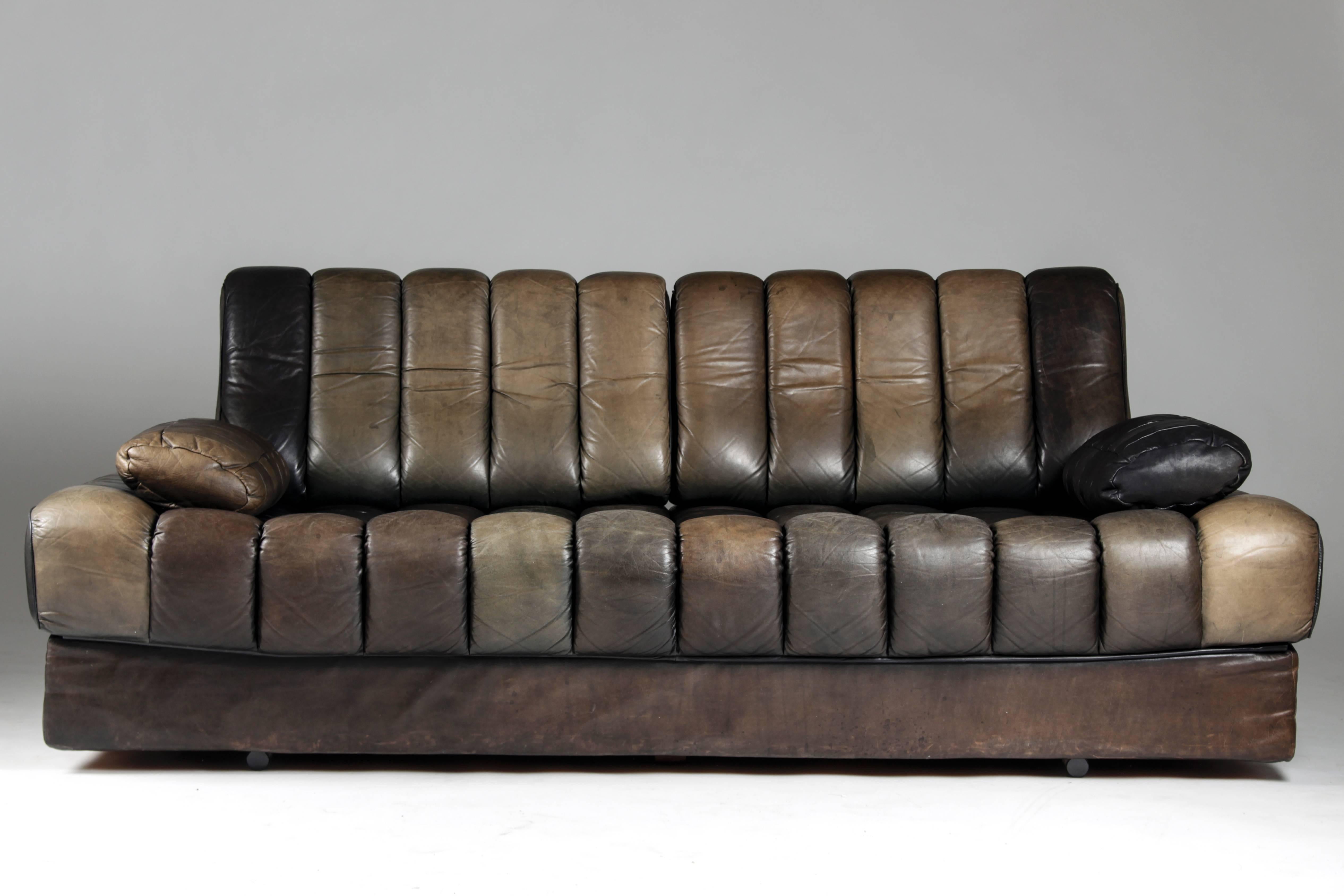Top quality sofa and daybed by De Sede. This sofa is in great vintage condition. It shows a perfect patina with the partly bleached leather, giving the sofa an extraordinary color scheme. The sofa has been professionally cleaned and reconditioned.