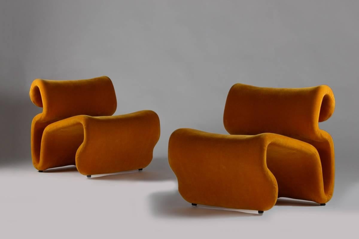A pair of mustard yellow lounge chairs model "Et Cetera", designed by Jan Ekselius for JOC Vetlanda in 1971. These lounge chairs are typical of their time, when a young generation of designers wanted to brake all rules about how to design
