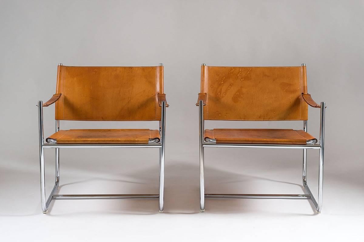 A pair of easy chairs model 