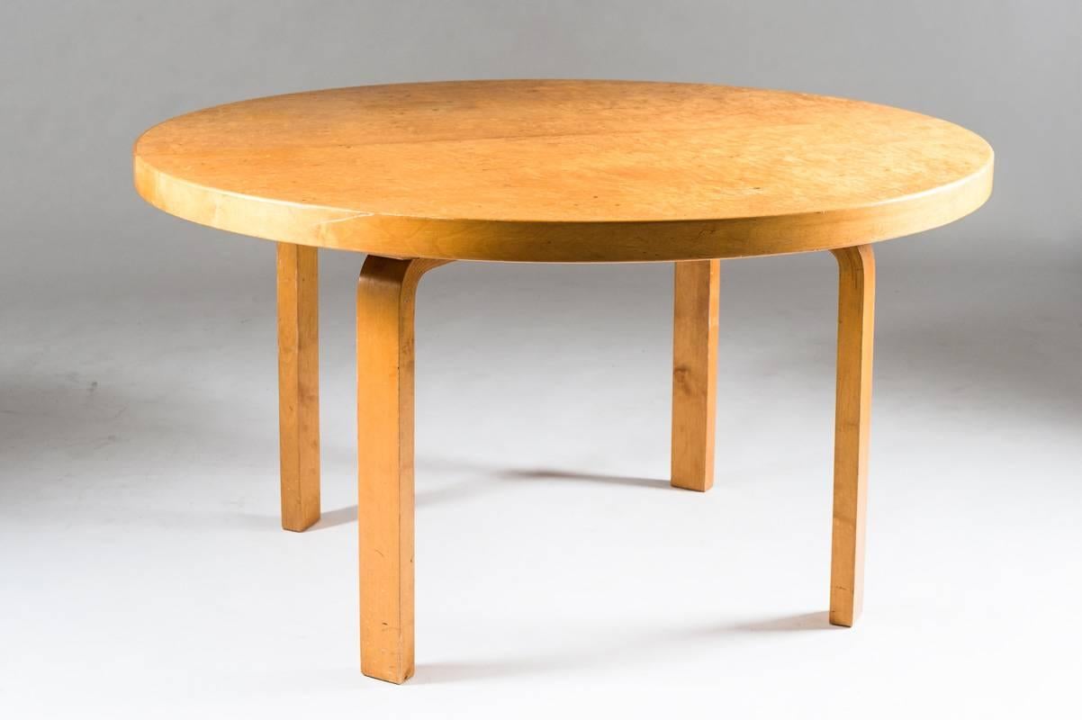 Dining table by Alvar Aalto for Aartek, Finland 1950s.
This beautiful table consists of a big round tabletop, veneered with Karelian birch, supported by Aalto's characteristic legs of bentwood. The table has no visible stamps or labels, but