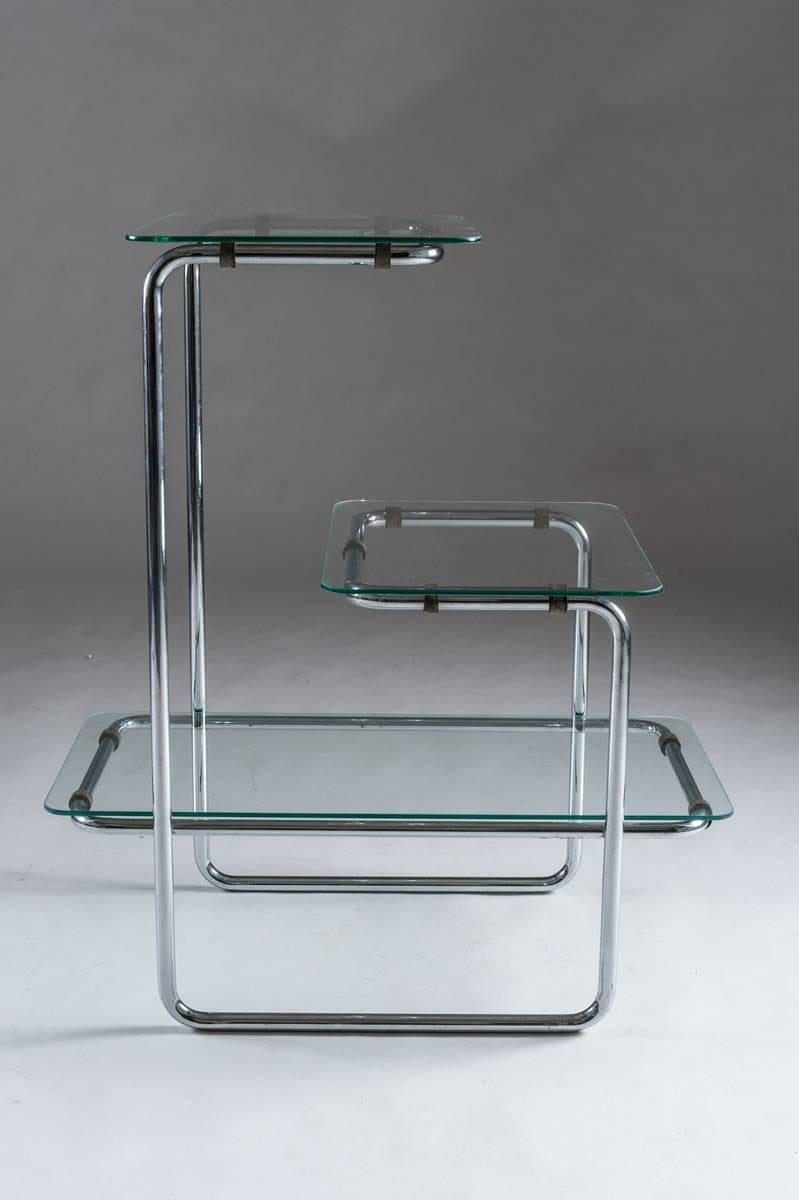 Shelves by Emile Guillot, circa 1930. These shelves have three levels with three glass panels on a chrome tubular frame.
Model B136.
Condition: Excellent vintage condition. Two of the glass shelves are new
Dimensions:
H 33.86 in.; W 29.13 in.; D