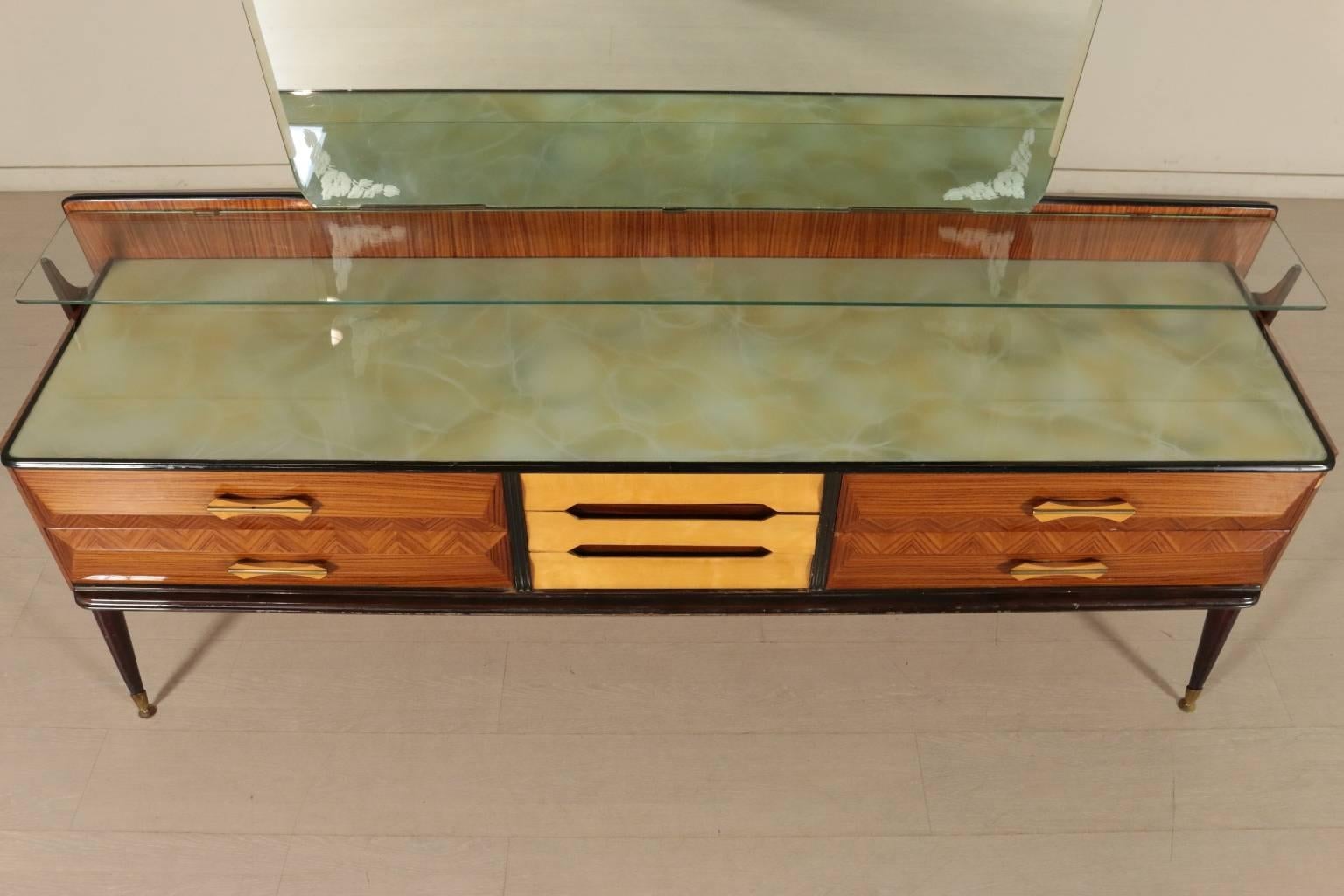 A chest of drawers with mirror, rosewood and ashwood veneer, back painted glass with marble effect. Manufactured in Italy, 1950s.