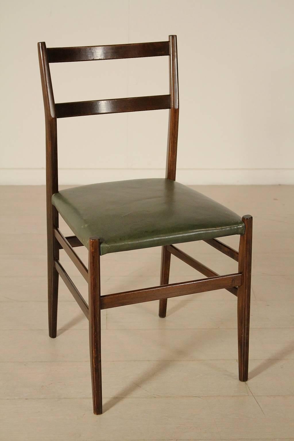 A group of four chairs designed by Gio Ponti, stained ash wood, leatherette seat. Manufactured in Italy, 1950s.